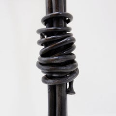 Large wrought iron candelabra with an abstract design and three candle holders