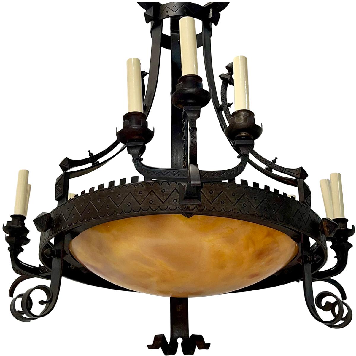 Circa 1910 Italian wrought iron chandelier with alabaster inset.

Measurements:
Height: 44.5″
Diameter: 30.5″