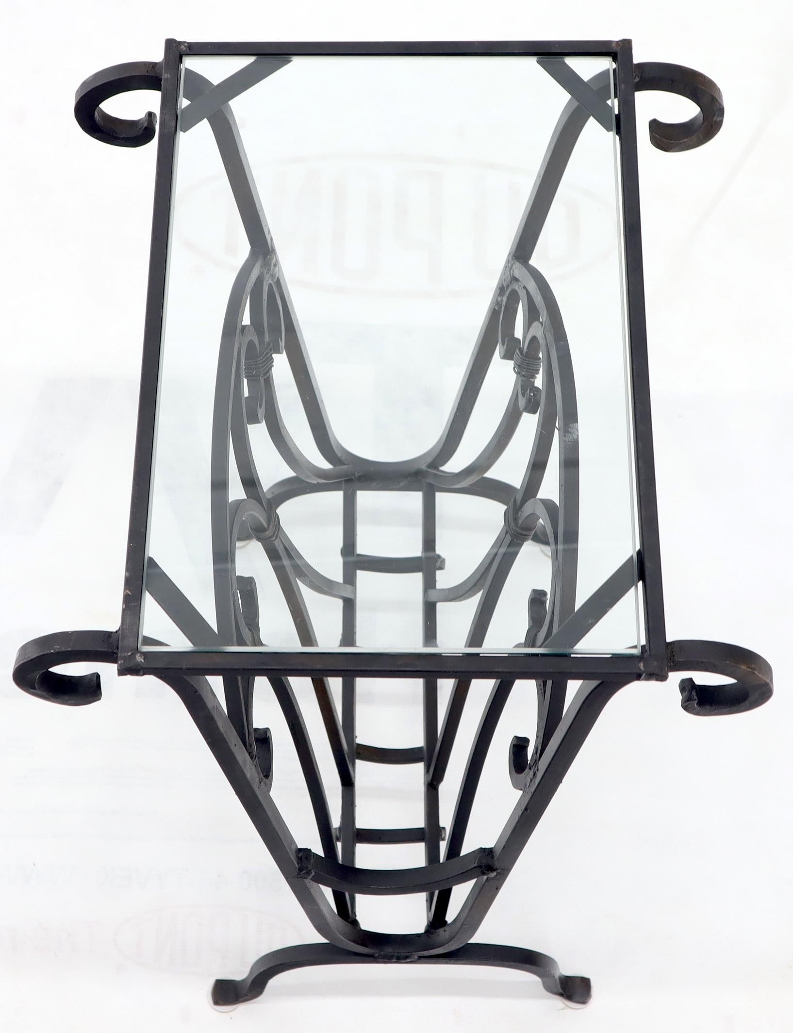Decorative wrought iron magazine stand rack end table with glass top.