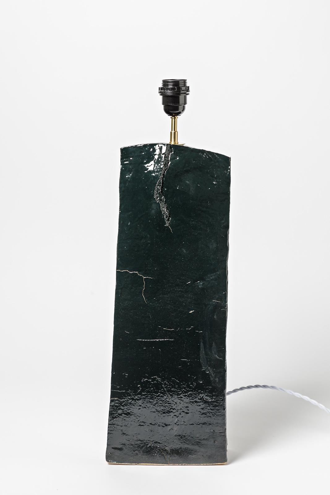 Unique piece

Large stoneware ceramic table lamp

Realised circa 1980

Dark green or black stoneware ceramic color

Original perfect condition

Electrical system is new - sold without lampshade

Ceramic measures - height 50 cm large 17