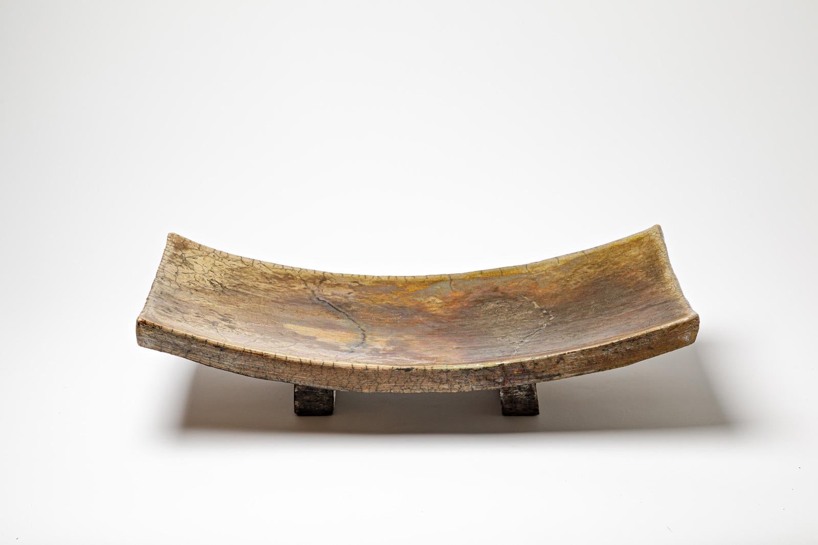 Large yellow and brown glazed ceramic cup by Gisèle Buthod Garçon. 
Raku fired. 
Artist monogram under the base. 
Circa 1980-1990.
H : 4.9’ x 10.6’ x 20.1’ inches.

