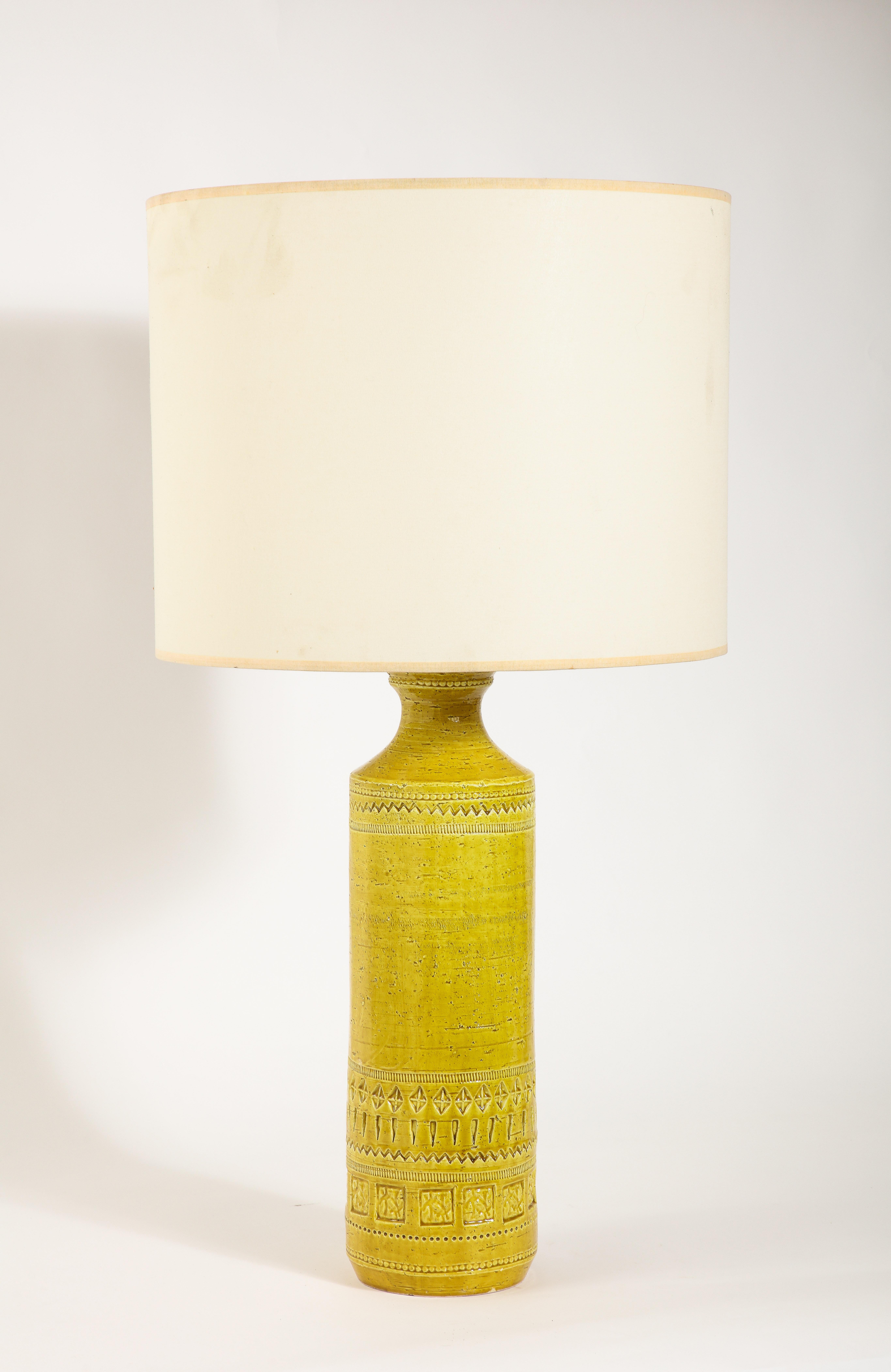 Large Incised ceramic table lamps with a rich yellow glaze.

25x7 Base Only
