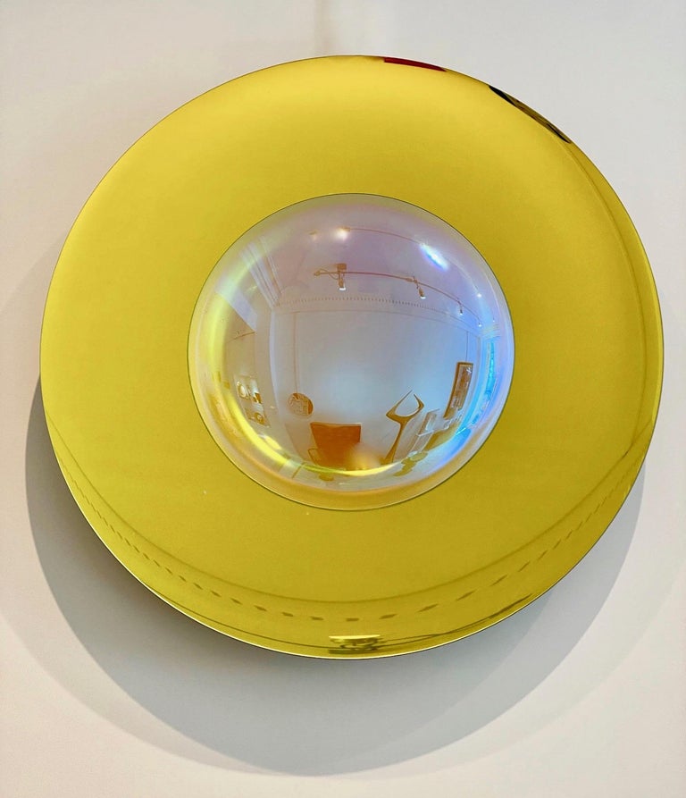 A shiny yellow mirror, concave glass bowl with a large opalescent lens in the middle, brass mount, bronze reflection, the bracket is signed by the french artist Christophe Gaignon . Unique piece.
Measures: Diameter 100 cm.
 