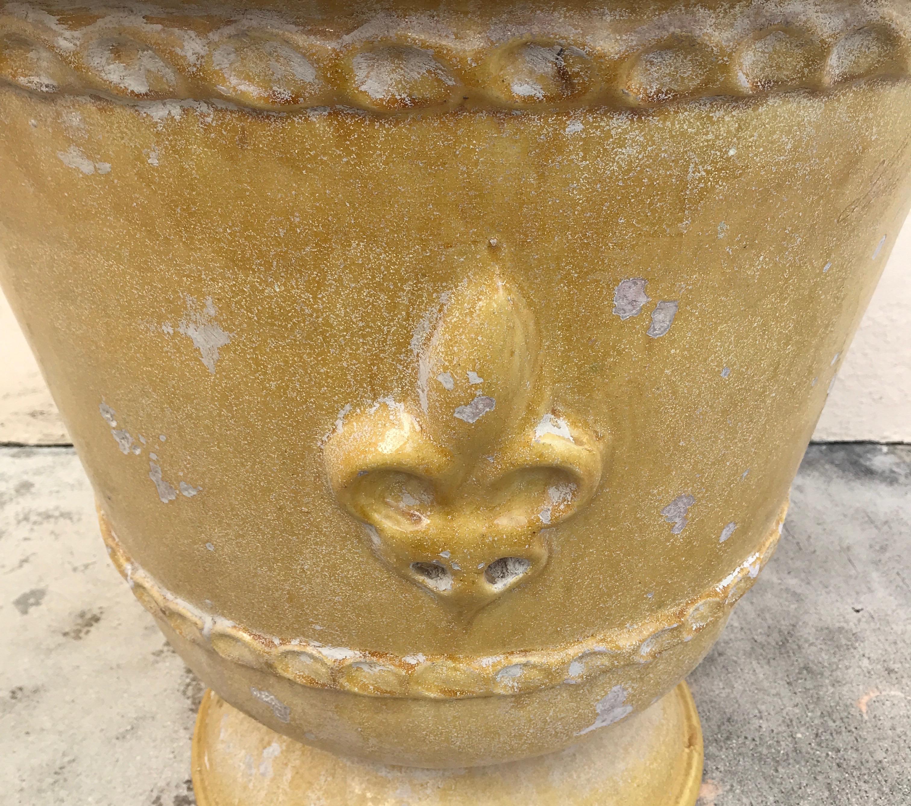 French country glazed terra cotta planter with raised fleur-de-lys design from the Provence region.