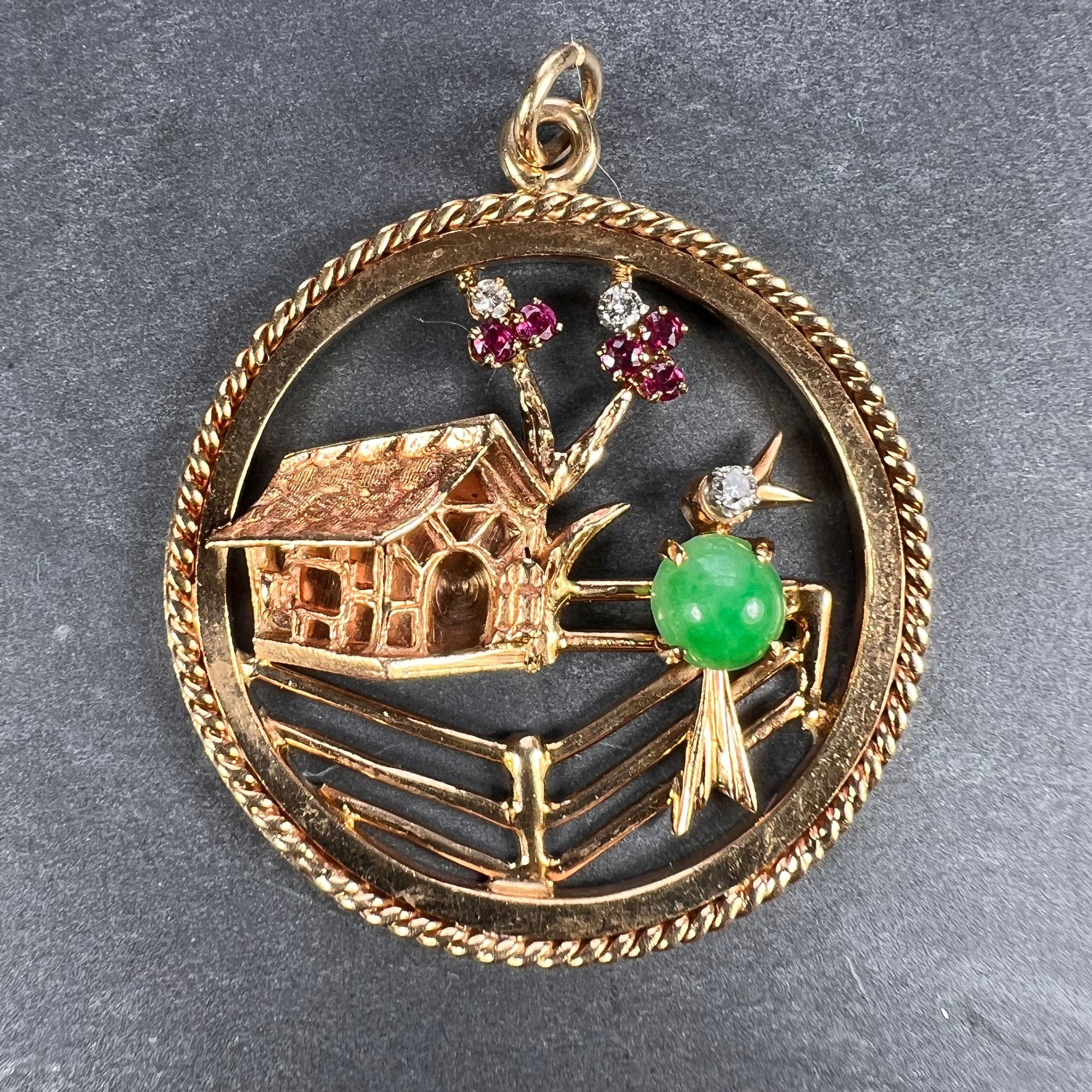 A large 14 karat yellow gold 'Home Sweet Home' charm pendant designed as a house and ruby diamond tree with a jade and diamond bird singing on a fence. Marked 14K for 14 karat gold and American manufacture.

Gem content:
Jadeite Jade cabochon