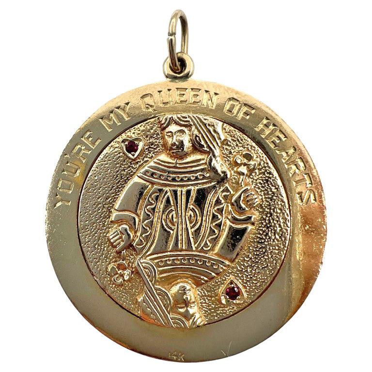 14kt yellow gold circular disk style pendant charm depicting the Queen of Hearts on one side and the King of Diamonds on the other.  Hand engraved figure depicting the King of Diamonds (card) with the border engraved in block font 