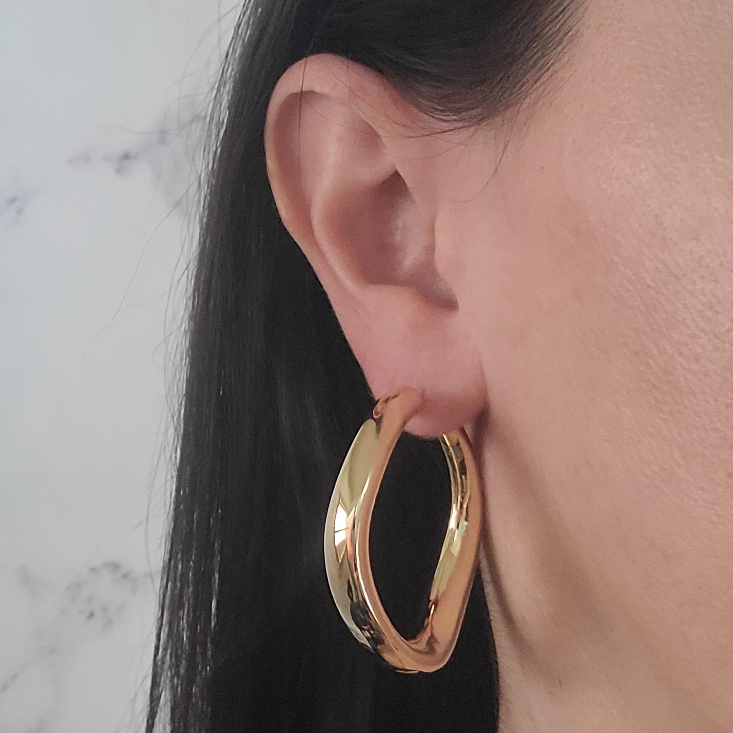 Large 18 Karat Yellow Gold Wave Hoop Earrings Created by Electroform Process with Light Weight Design. Pierced Post with Hinged Closure. 1.75