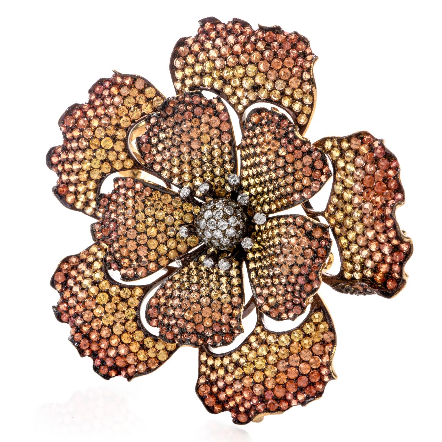 Big and bold in design!

This 18k yellow gold Flower pin features 28.60 carats of round brilliant- cut genuine yellow Sapphire in

different shades of color from yellow to orange.

It is centered with 1.35 carata of high-quality diamonds, G-H color,