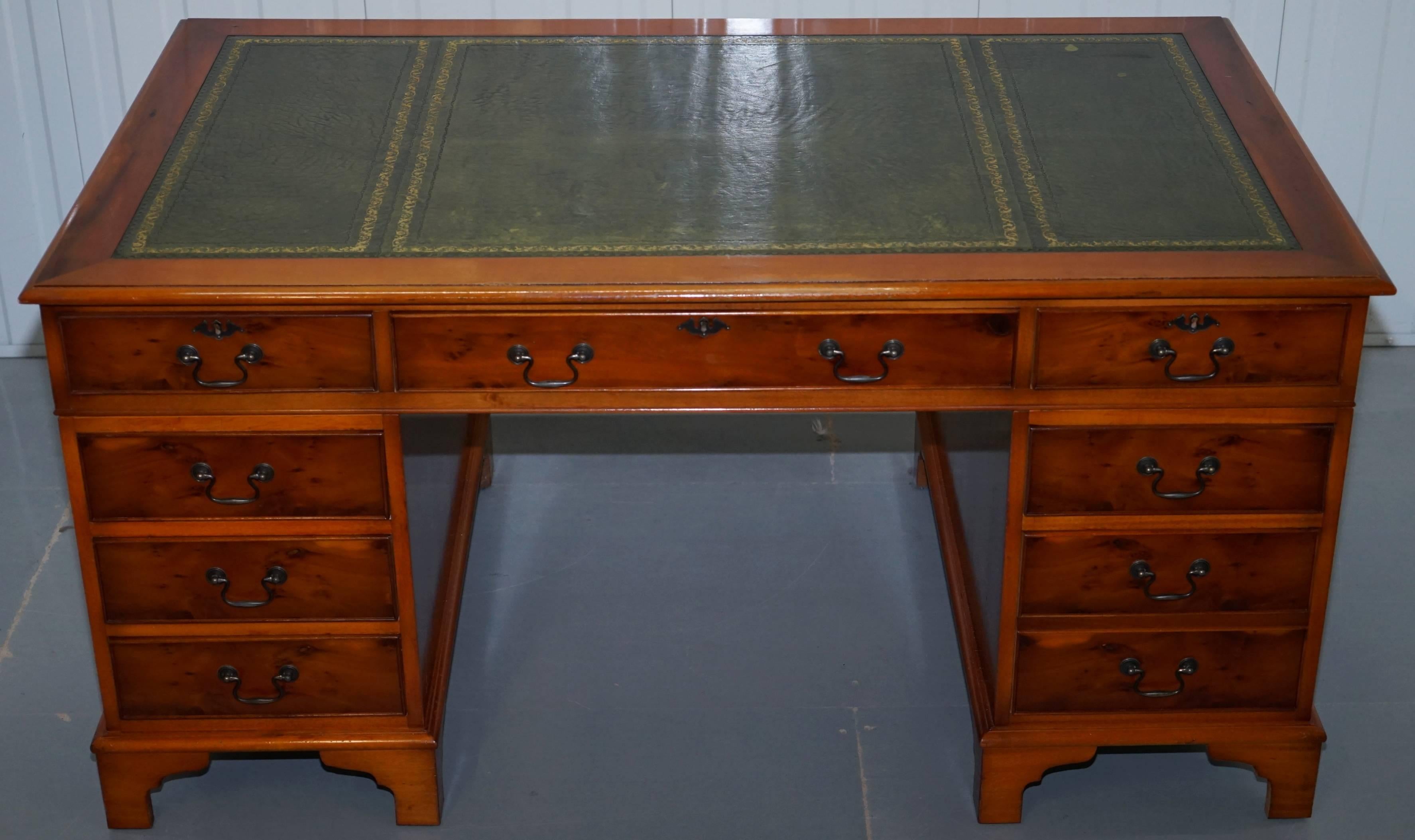 We are delighted to offer for sale this lovely large yew wood twin pedestal partner desk with green leather top

A very well made piece, the desk splits into three pieces for ease of transport 

As you can see the leather nicely worm, there are