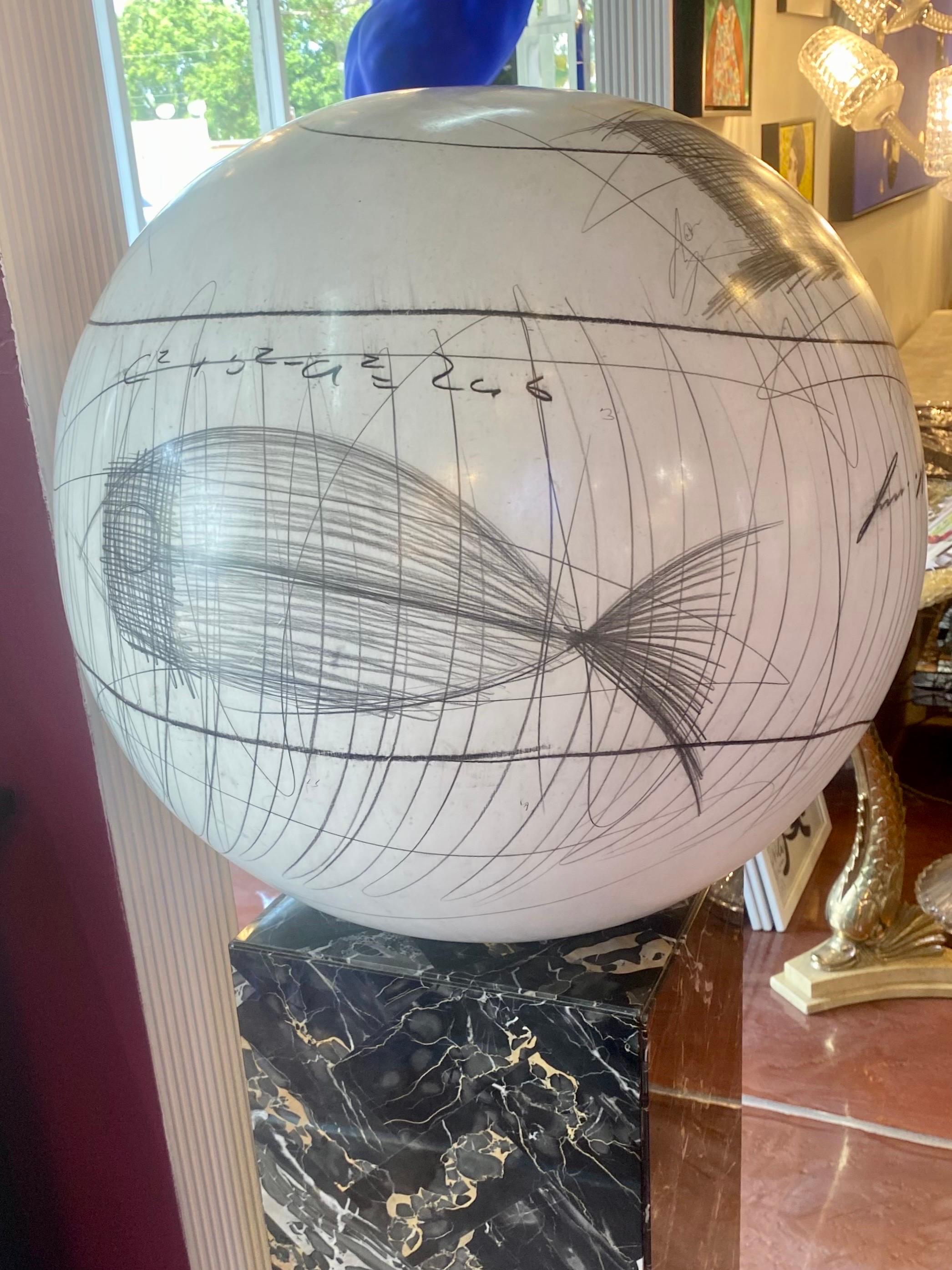 Contemporary large white ceramic decorative sphere with a printed pattern of pencil and charcoal equations, scribbles, a fish and diagrams ( by YURI ZATARAIN) The marble pedestal is not included. 