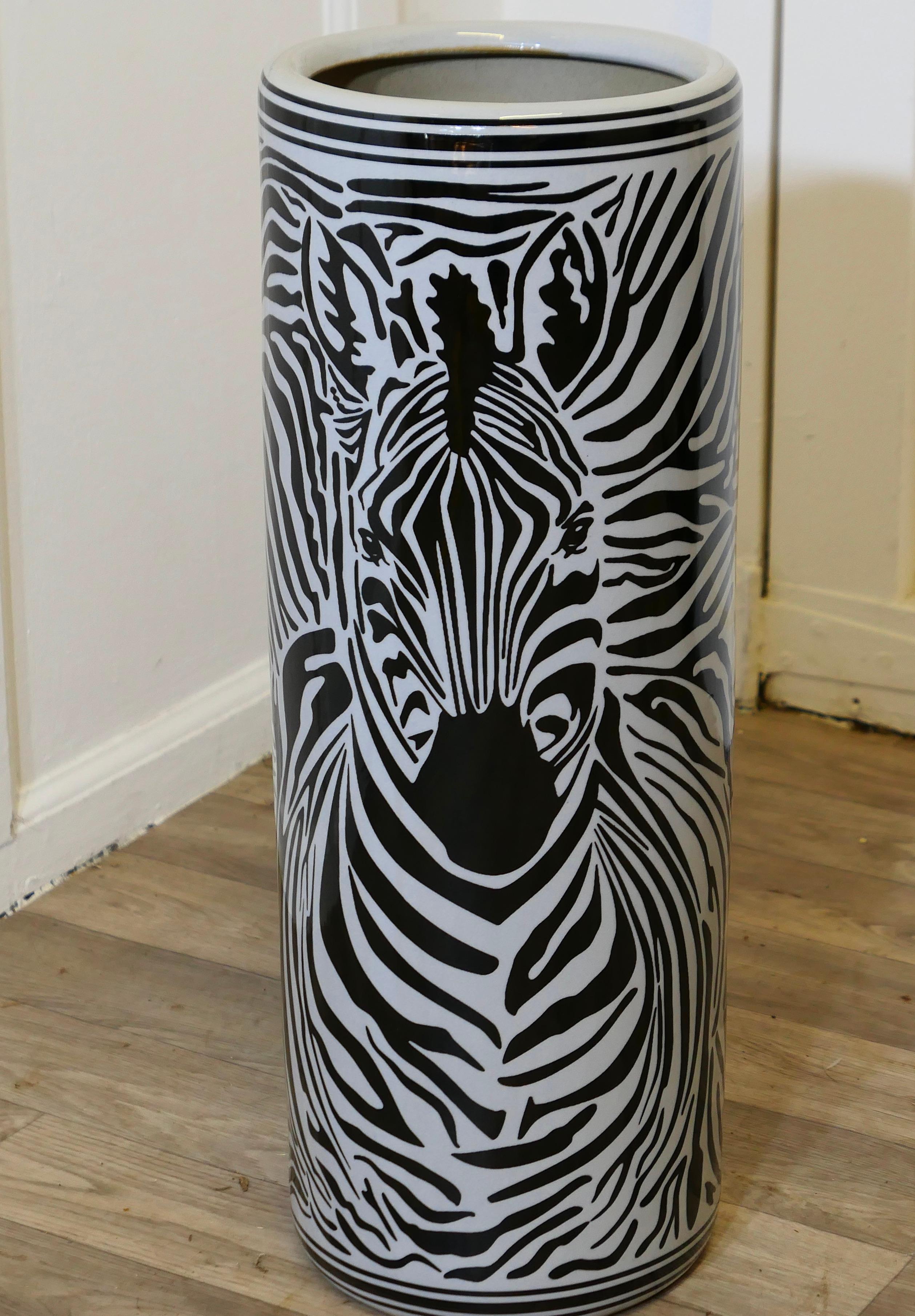 Large Zebra Design Floor Vase, Umbrella Stand

This beautiful looking piece is round in shape, and painted, the painted decoration of a Zebra runs all the way around, it is 24” tall and 9” in diameter
TNG293