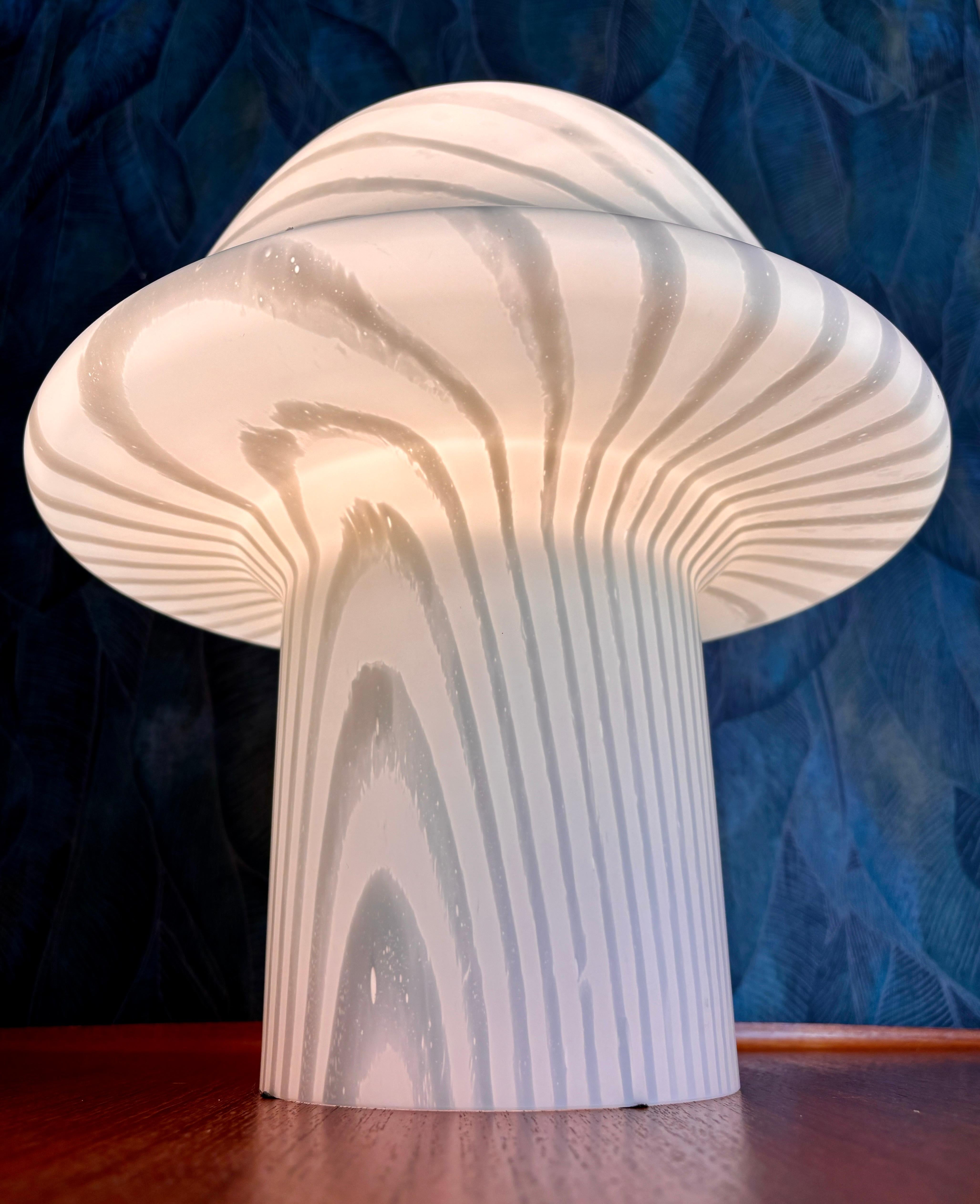 Very beautiful hand-blown Murano table lamp (made from a single piece) by Phill & Putzler.

Beautiful mid-century design glass with an E27 socket for max. 40W.
Matches the wall/ceiling lamp, which is also available in my shop.

Very good vintage