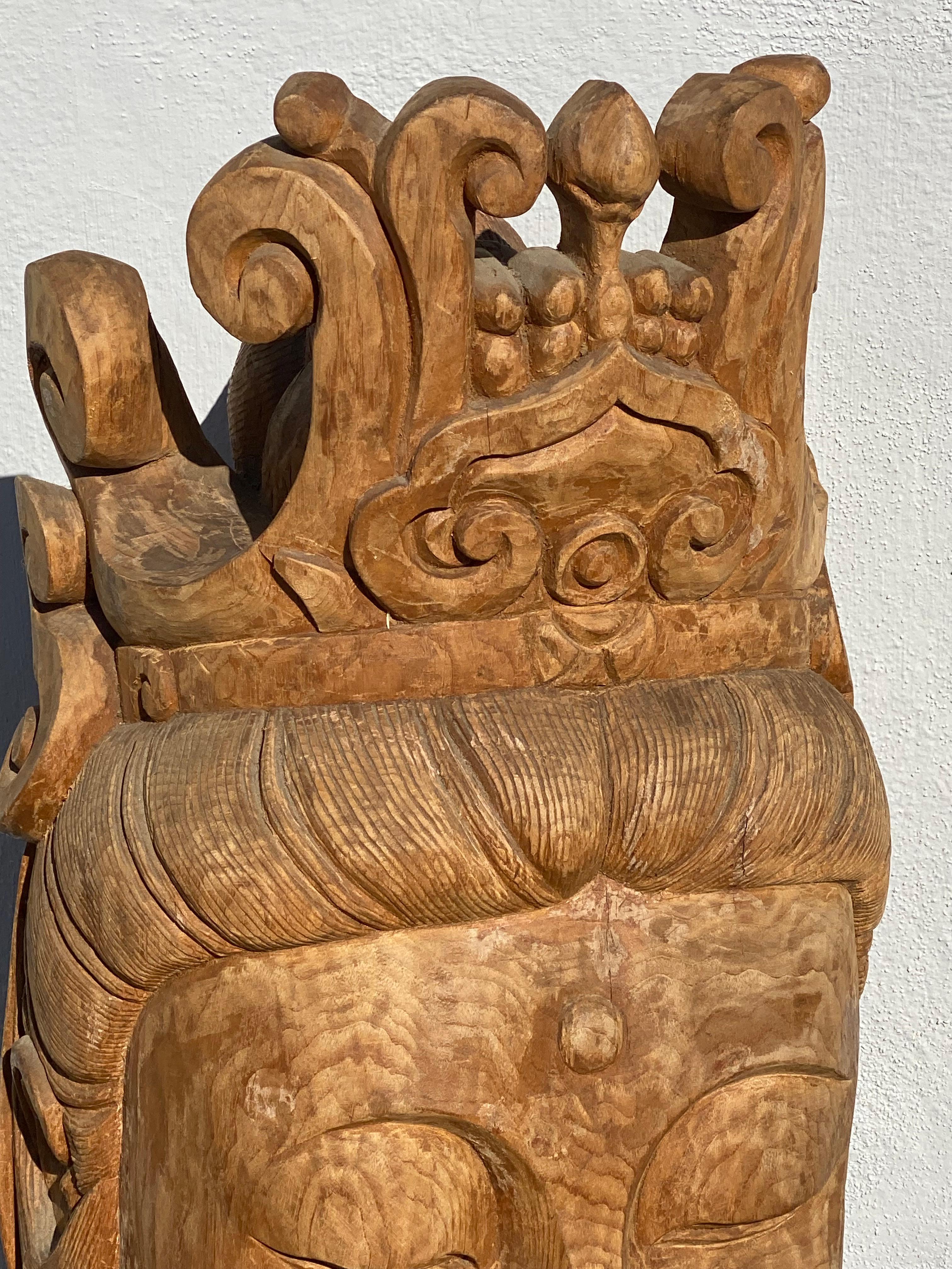Large 20th century Chinese head of Guanyin. This piece is quite large and has been hand crafted by a skilled artisan from a single log. It measures 27 1/2” tall x 14” deep x 14” wide and weighs 42 pounds. There is some age and patina to the wood.