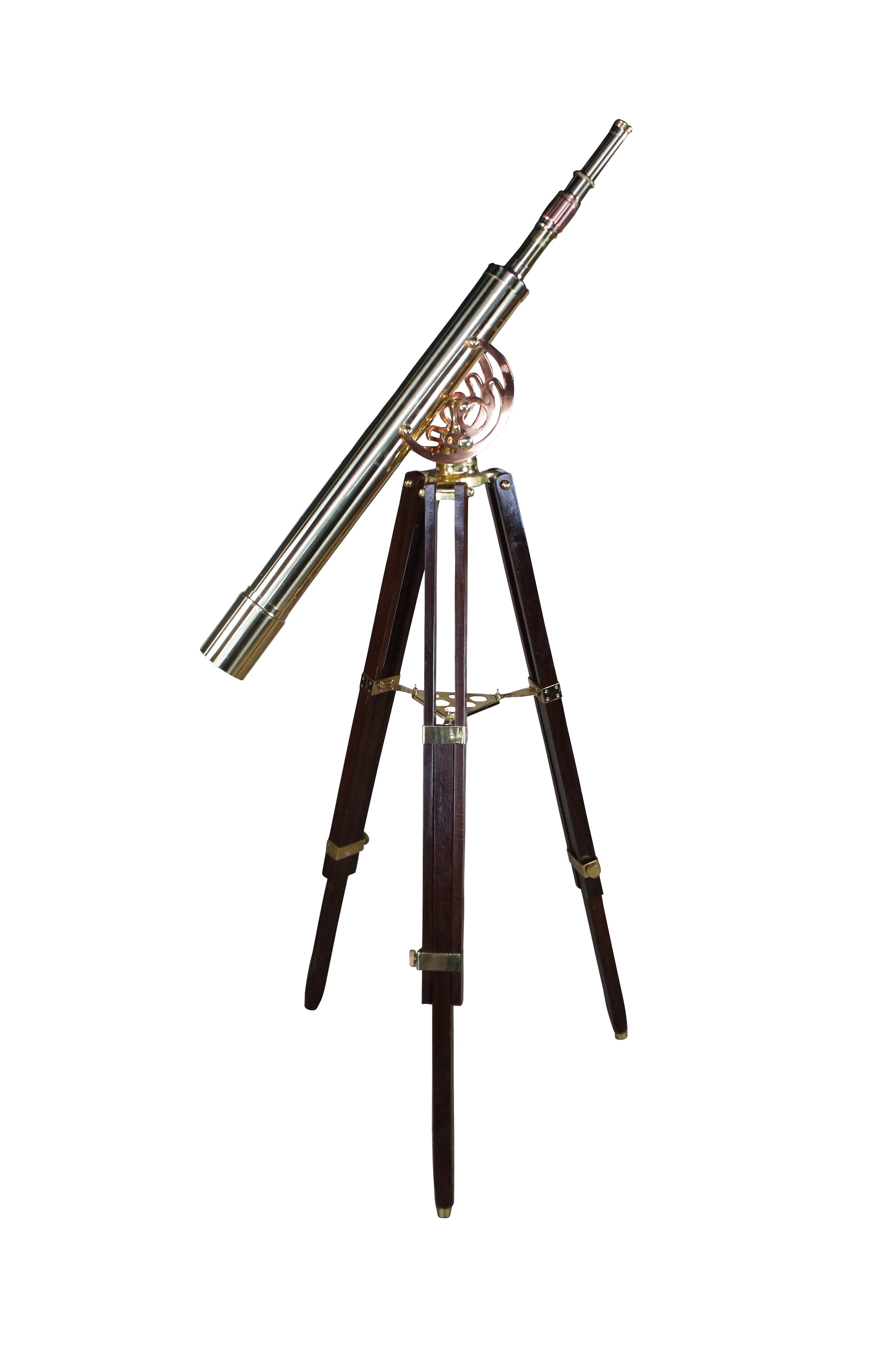 An exquisite brass spyglass telescope by Zhumell.  Features a large scope mounted to a copper swing over a mahogany brass accented articulating base.  Circa last quarter 20th Century.

Zhumell Telescopes has been a popular brand among amateur