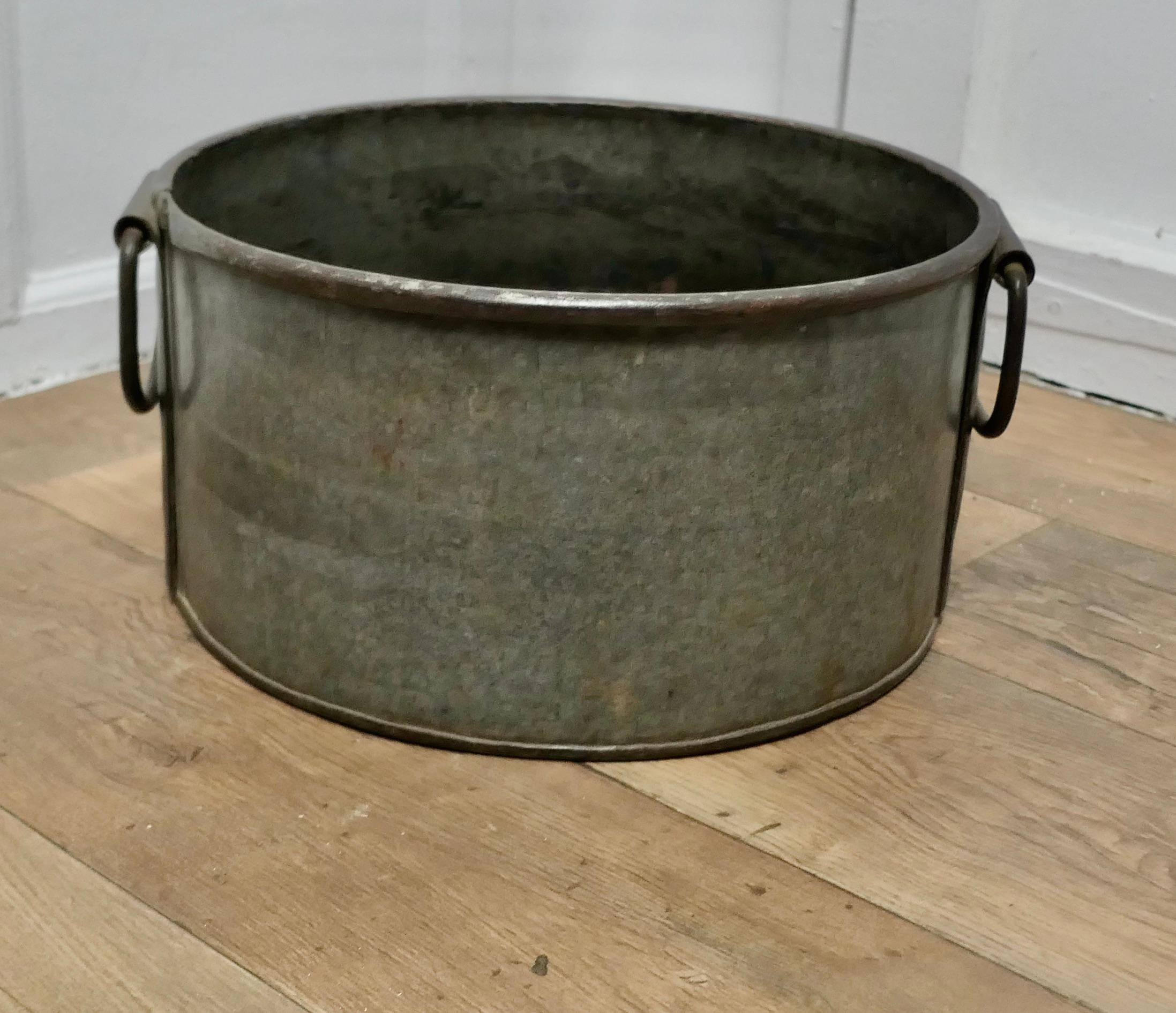 Large Zinc and Iron Cauldron Log Basket

This is a large galvanised pot it has riveted carrying swing handles

An unusual piece of brutalist design, a heavy piece and it would make a great log carrier
The bucket is 14” high and 17” in diameter 
SC38
