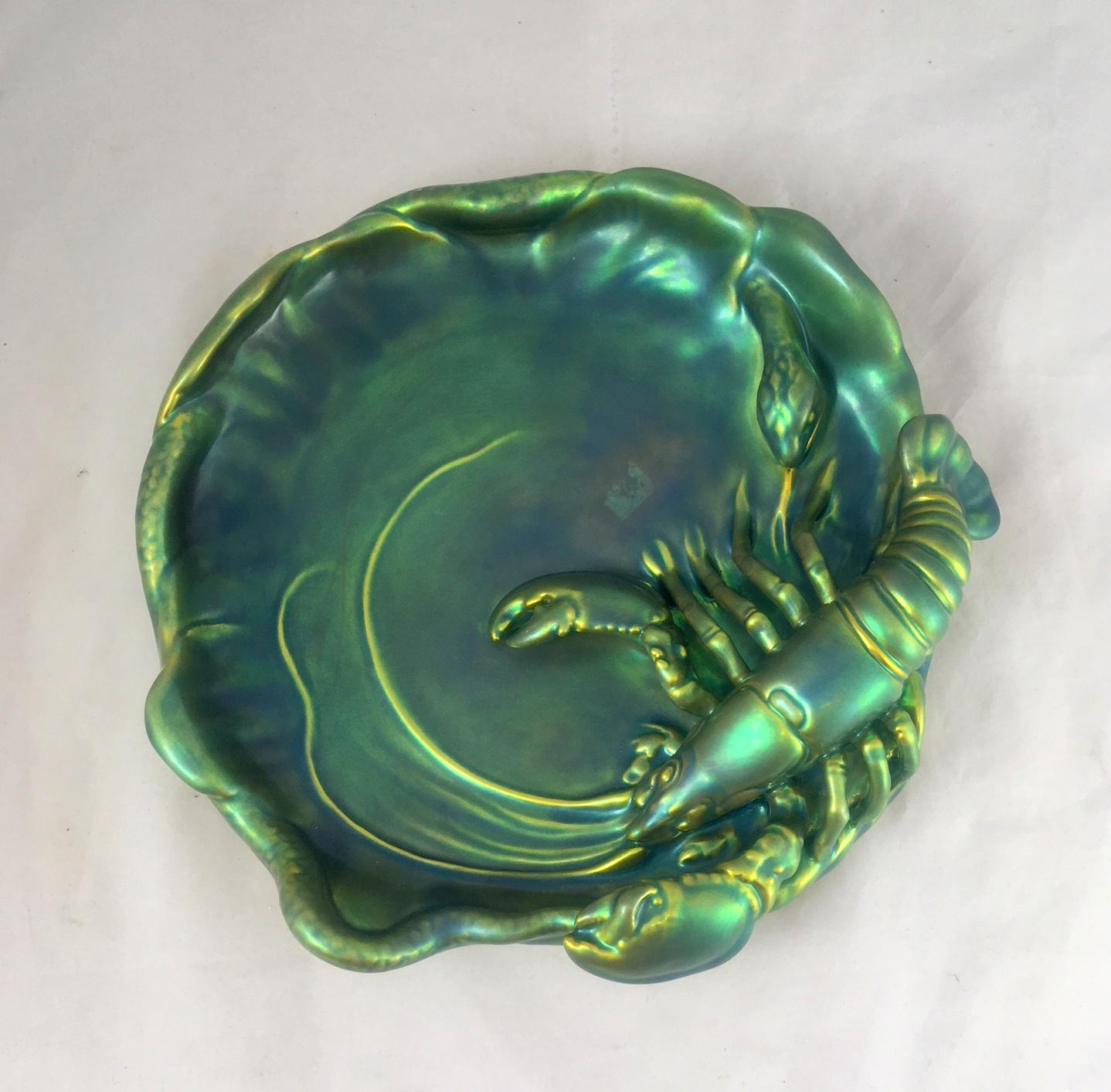 Art Nouveau Zsolnay dish with an eosin glaze. The crab and snake motive makes this stunning and rare vintage Zsolnay plate a real collector’s piece. Zsolnay is the only ceramic company that uses this unique green/ yellow glaze, originating from the