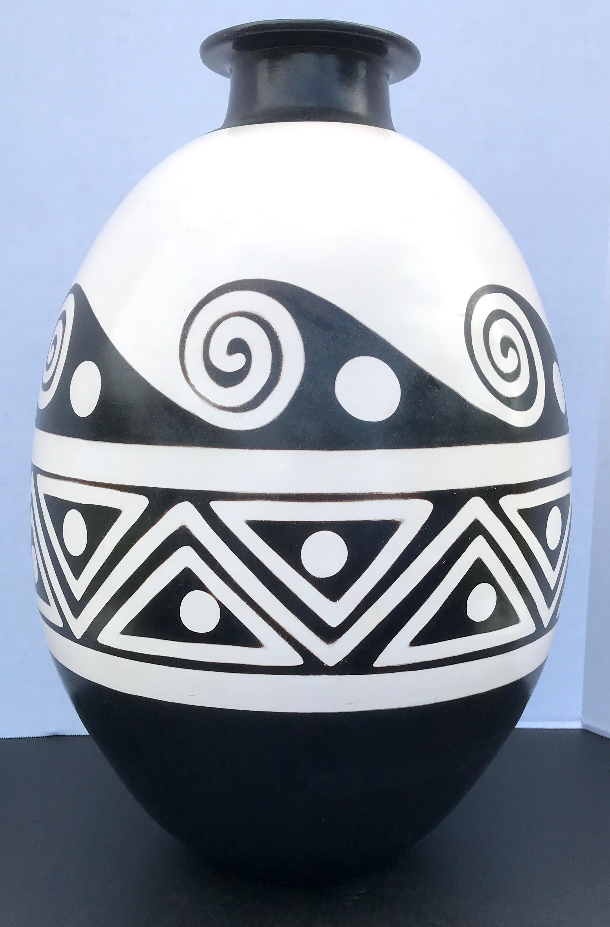 Large French Art Deco pottery black and white vase, hand painted with continuous abstract designs, with a nod to Jean Dunands work. Unmarked.