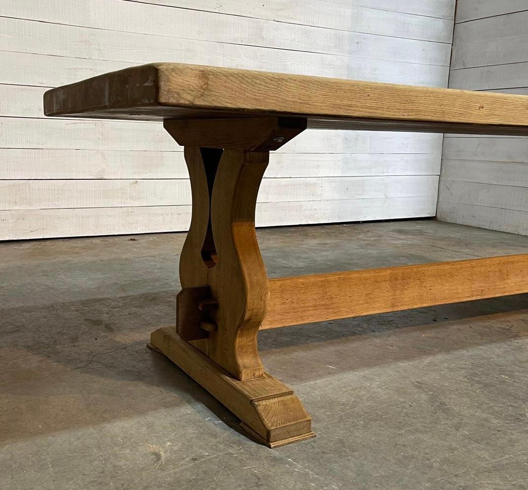 A superb quality and larger size solid Oak Farmhouse Trestle end Dining Table. Dating to the early 1900s and of excellent quality construction this table will be around for generations to come. 
We have bleached it for a lighter look and to bring