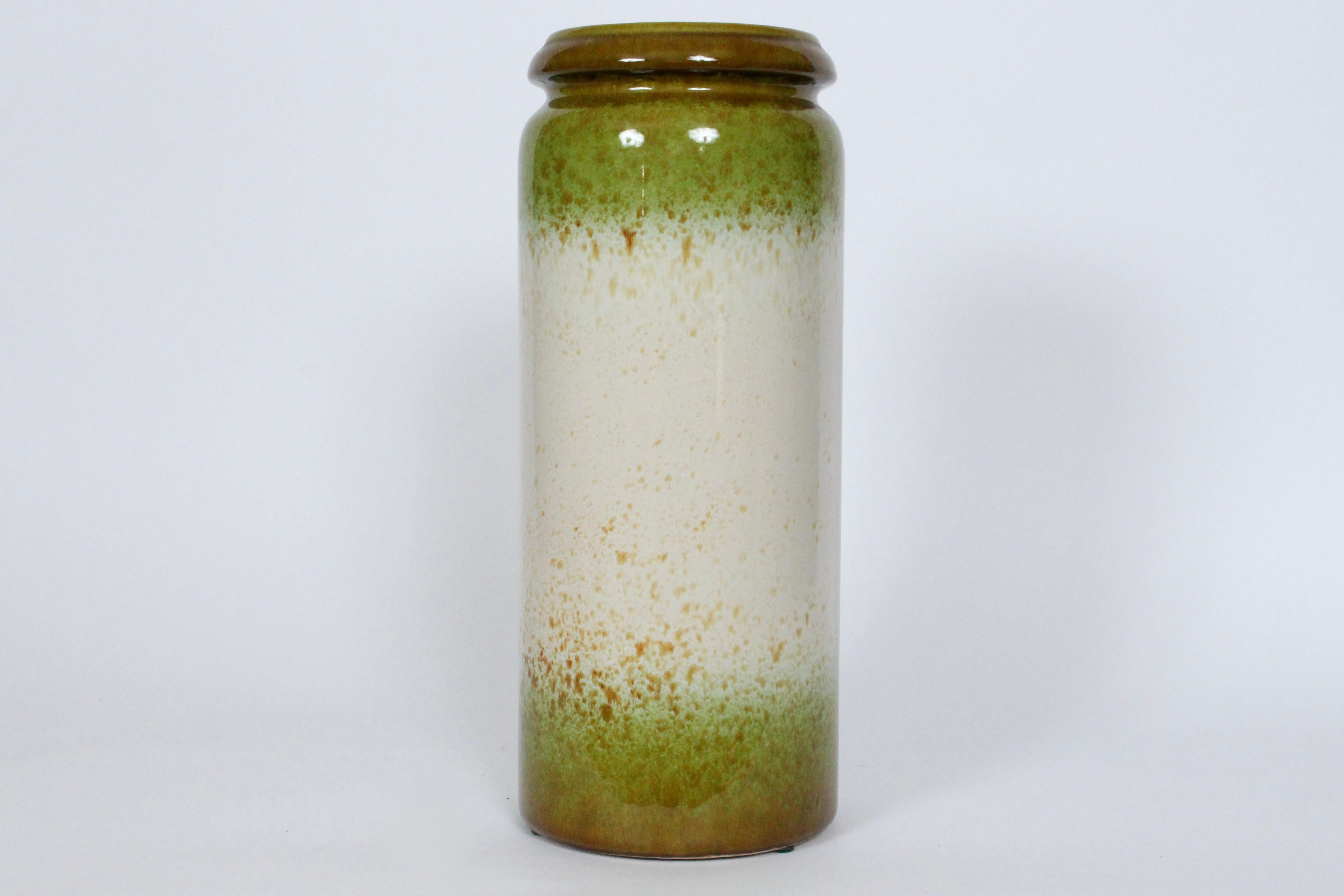 Tall Organic Modern West German Scheurich Keramik Glazed Art Pottery Vase. Featuring a handcrafted cylindrical Pottery form, smooth reflective glaze, Oatmeal center, Spring Green with Coffee Brown splatter effect to top and bottom, with Brown