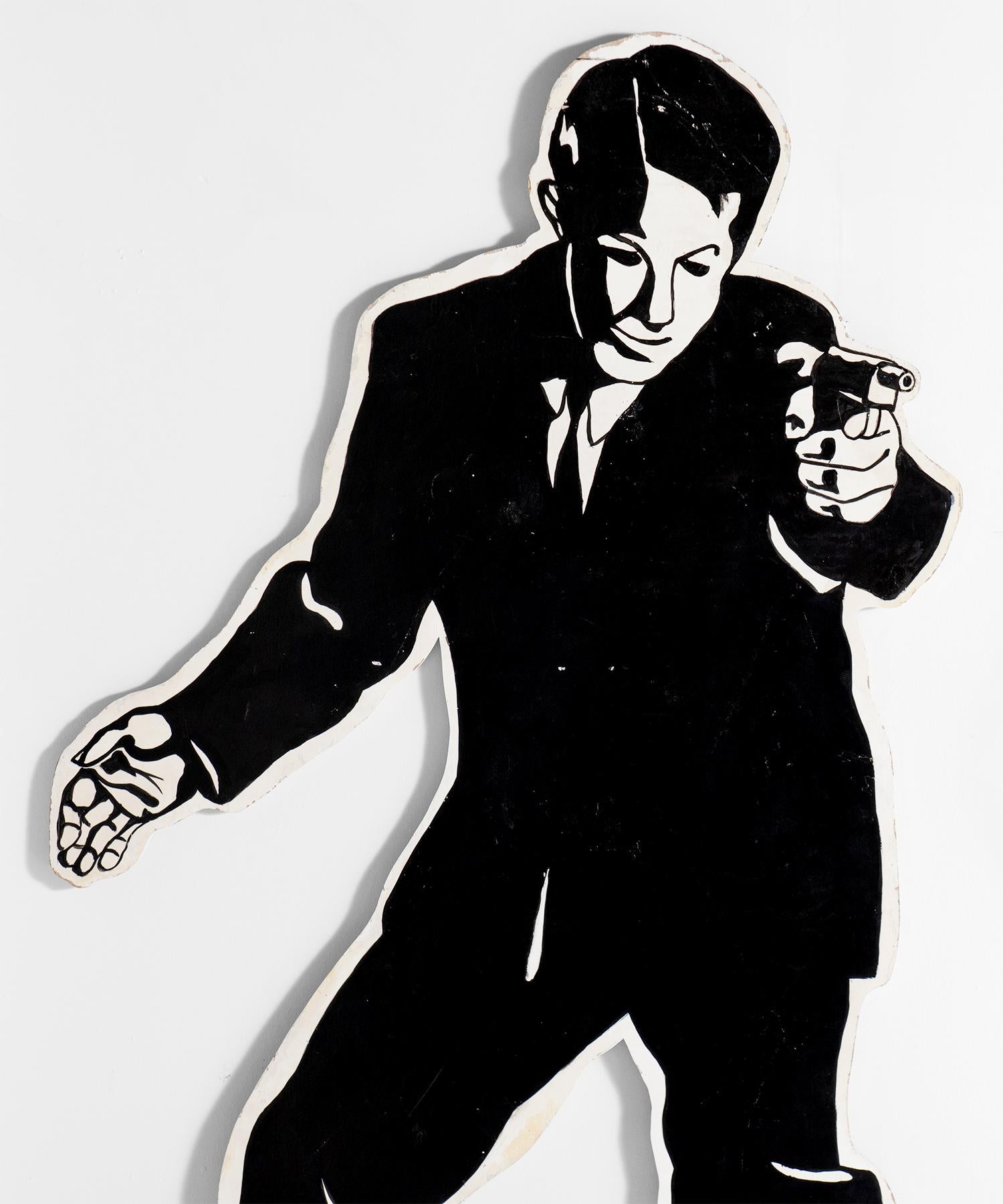 Painted plywood cutout of a secret agent.