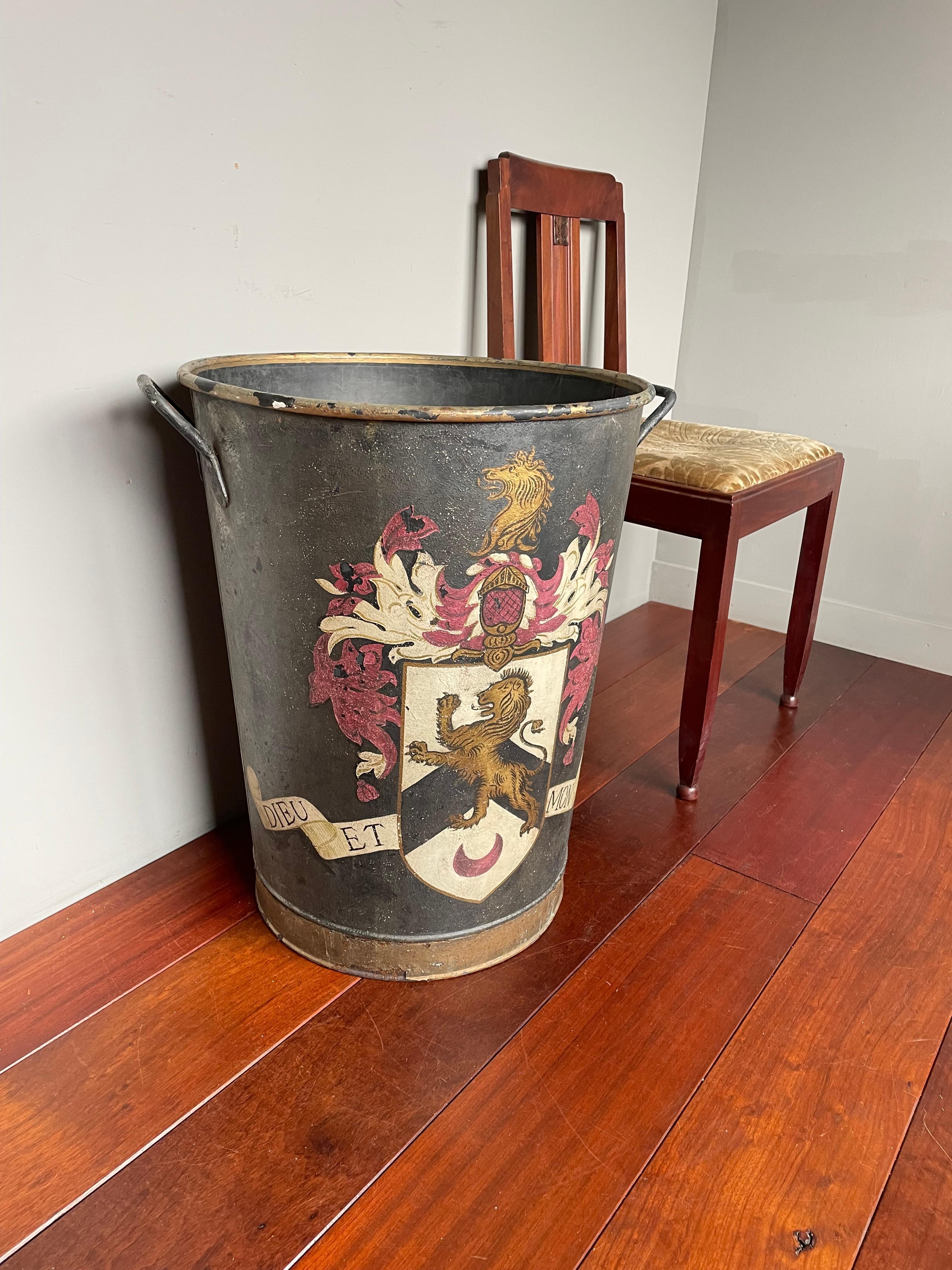 Stylish and decorative antique with handpainted crest with 'Dieu Et Mon Droit' banner.

This very large bucket is the ideal decorative antique to keep your firewood in. Over the years we have seen and sold some antique fireplace tools and buckets,