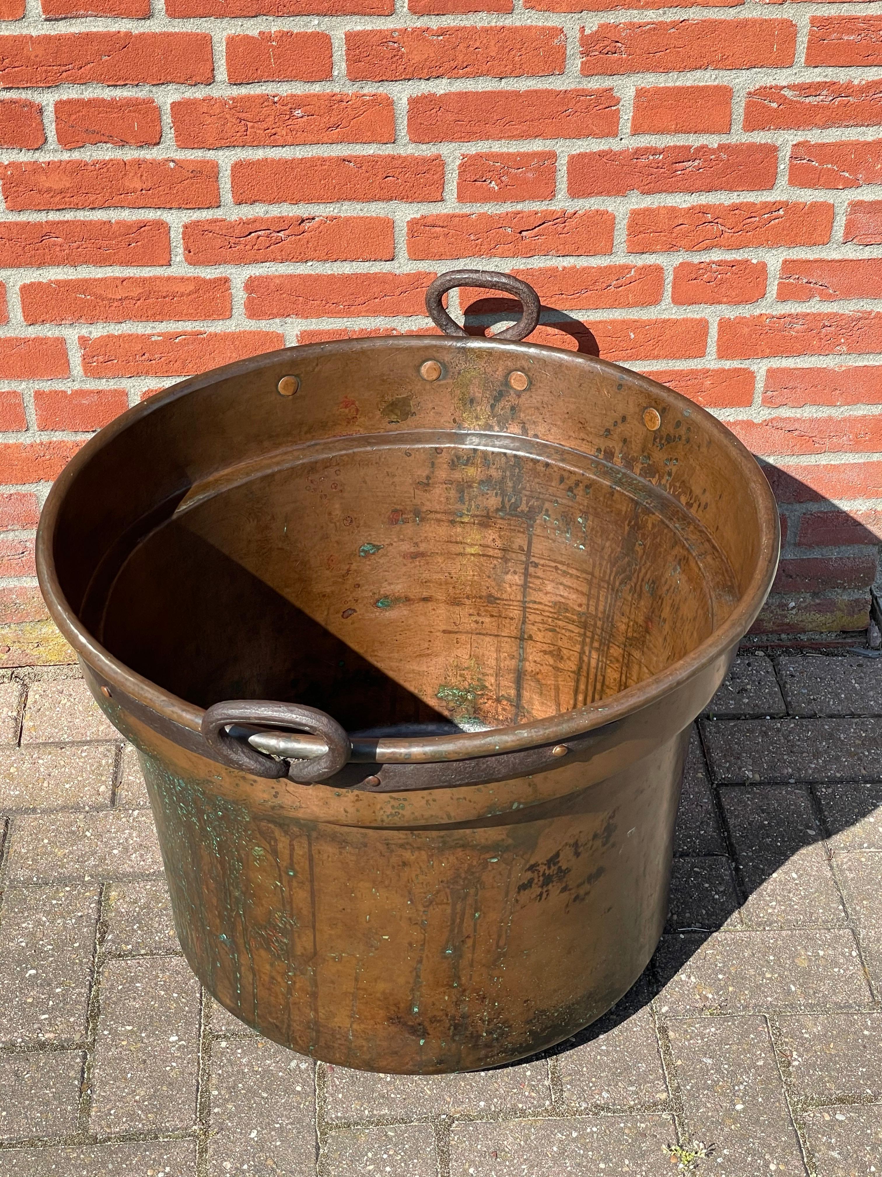 Marvelous size and timeless shape, copper bucket for inside and outside usage.

Only the wealthiest of people in the mid 1800s would have been able to afford a hand-crafted copper bucket of this size and quality. This extra large antique bucket