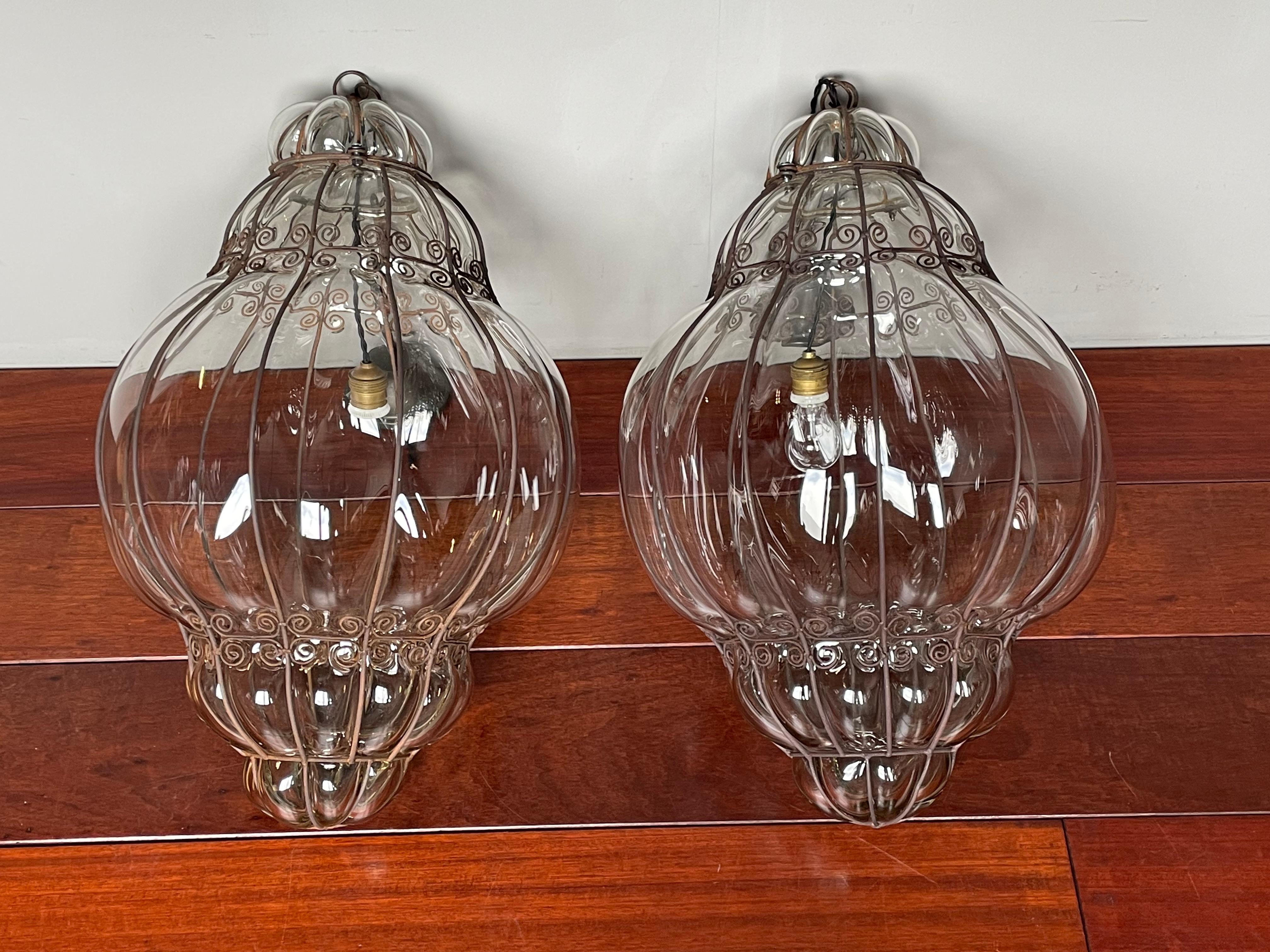 Extra large and superb condition, pair of vintage Murano mouth blown chandeliers.

To give you a better idea of the extra large and wonderful size of these striking Murano fixtures we have added images 5, 13 and 19 where they are placed next to one