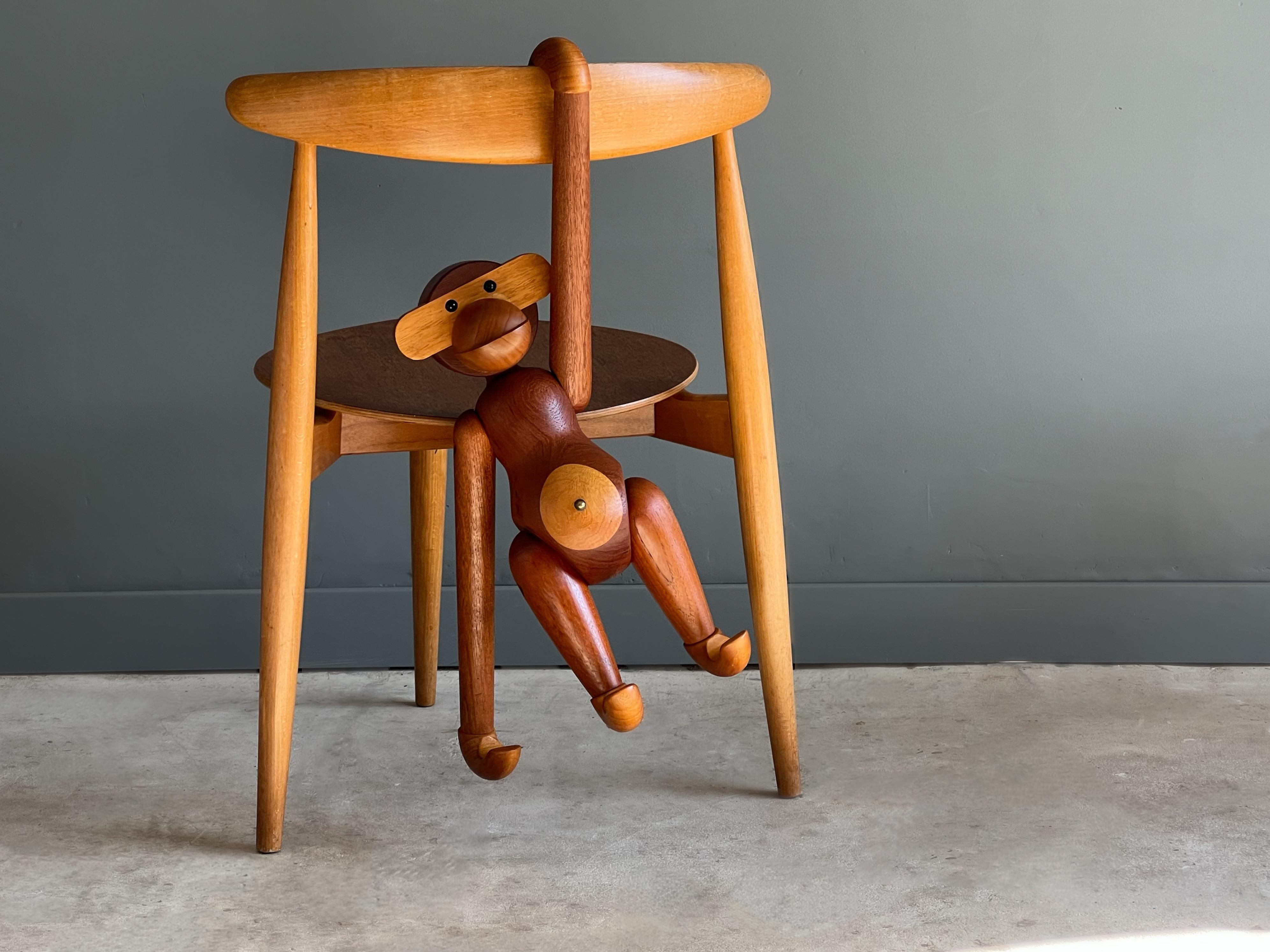 Vintage early example of the largest production monkey designed by Kay Bojesen. Originally designed in 1951. 

Kay Bojesens monkey comprises of 31 individual parts and is made from teak and limba wood. Each example is produced in Denmark and is