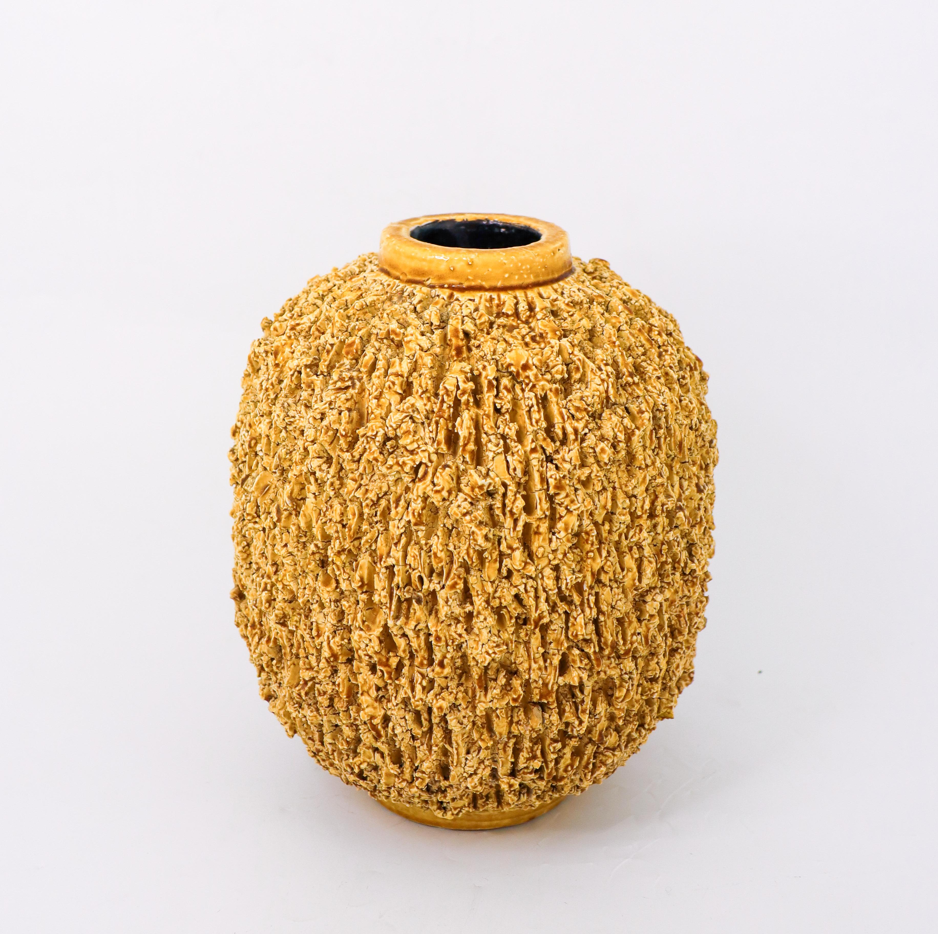 The largest yellow hedgehog vase designed by Gunnar Nylund at Rörstrand, the vase is 21 cm high and it is in very good condition except from some minor cracks at the base. It is marked below as on photo. These Hedgehog vases has become iconic for