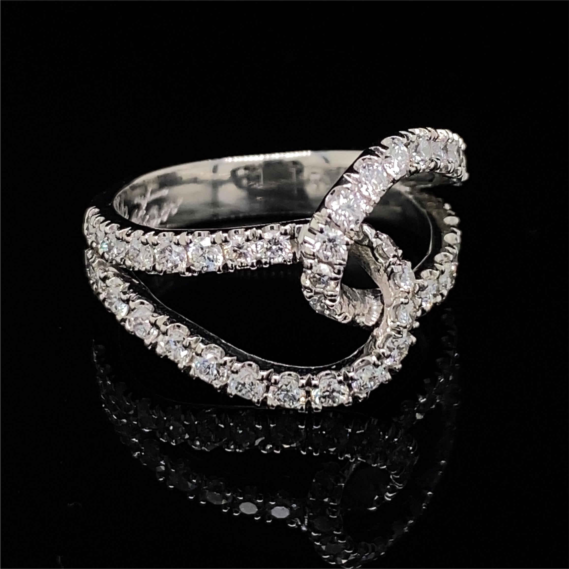 This is a classic design rendered with equestrian flair by Eytan Brandes in platinum with 44 bright white high-quality natural, earth-mined and untreated diamonds with a total weight of 0.88 carats in clean, modern U settings.  

Made from a single