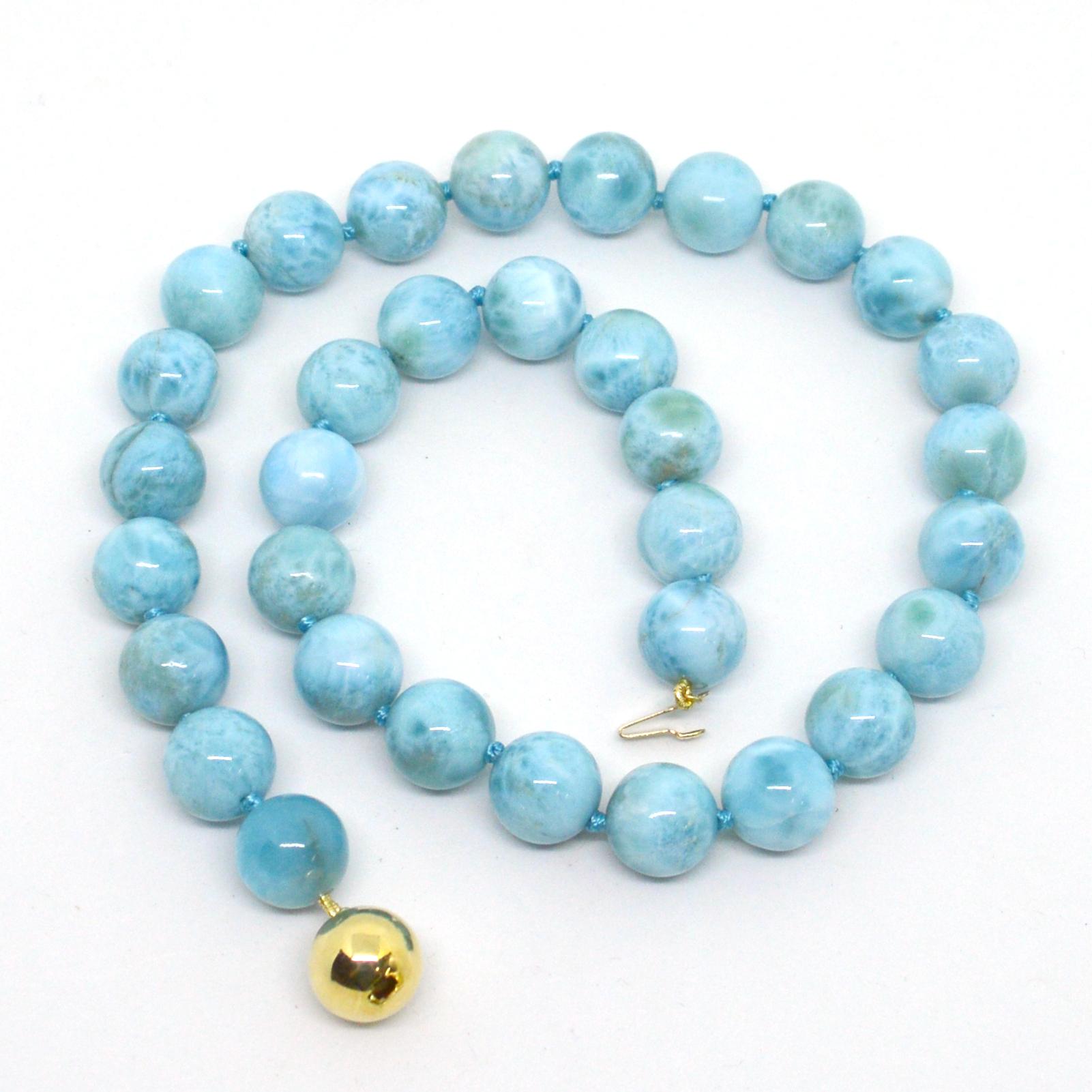 Beautiful high grade Larimar necklace hand knotted on matching thread with a 9 carat gold ball clasp.
Beads are 12mm and necklace measures 45cm in length.