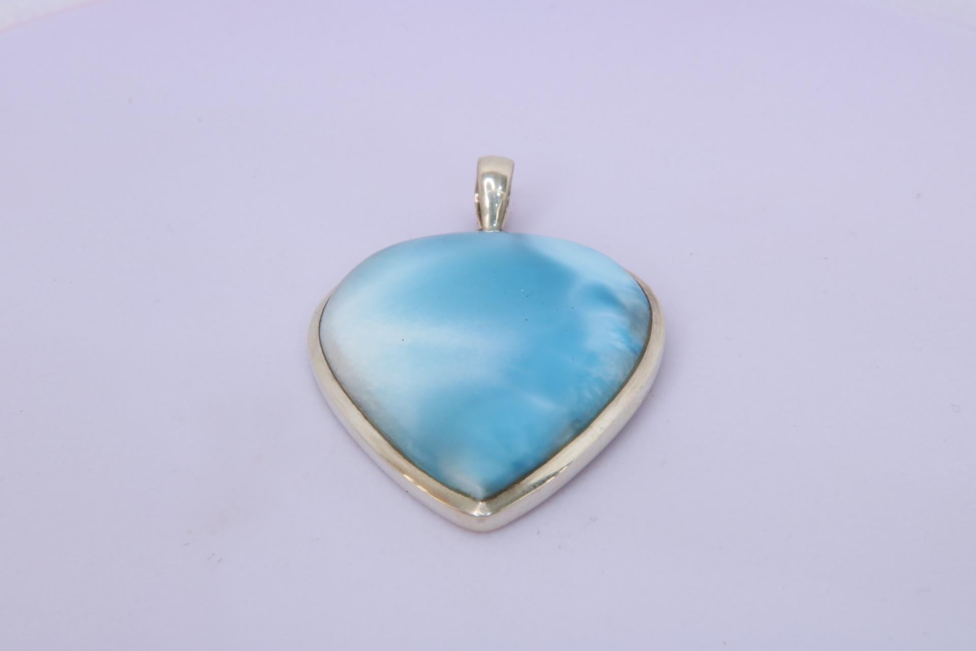 Handcrafted Sterling Silver Larimar Pendant.

Discover the enchanting allure of Larimar, the rare gemstone exclusively from the Dominican Republic. Known as the 