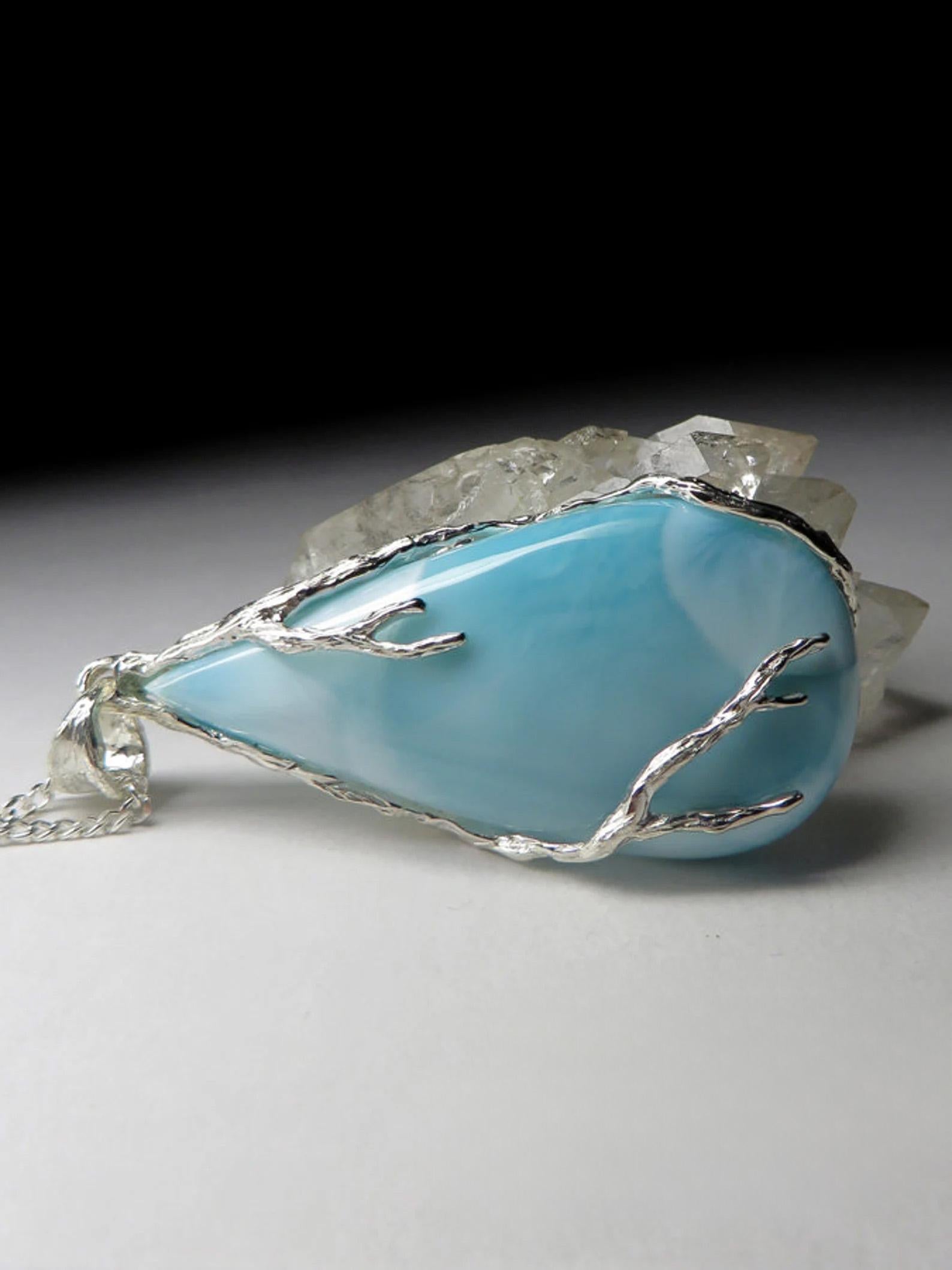 Silver pendant with natural Larimar
larimar origin - Dominican Republic
larimar measurements - 0.31 х 0.79 x 1.65 in / 8 х 20 х 42 mm
stone weight - 61.40 carats
pendant height - 2.28 in / 58 mm
pendant weight - 17.36 grams