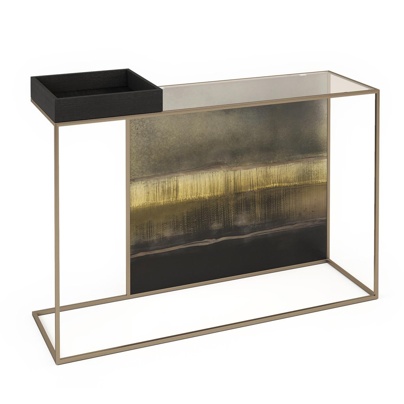 Introducing a console that seamlessly marries elegance and craftsmanship. The burnished brass-finished metal frame supports an extra-clear acid-etched glass back adorned with the Lipari decor. The wooden box, finished in brushed durmast with a sleek