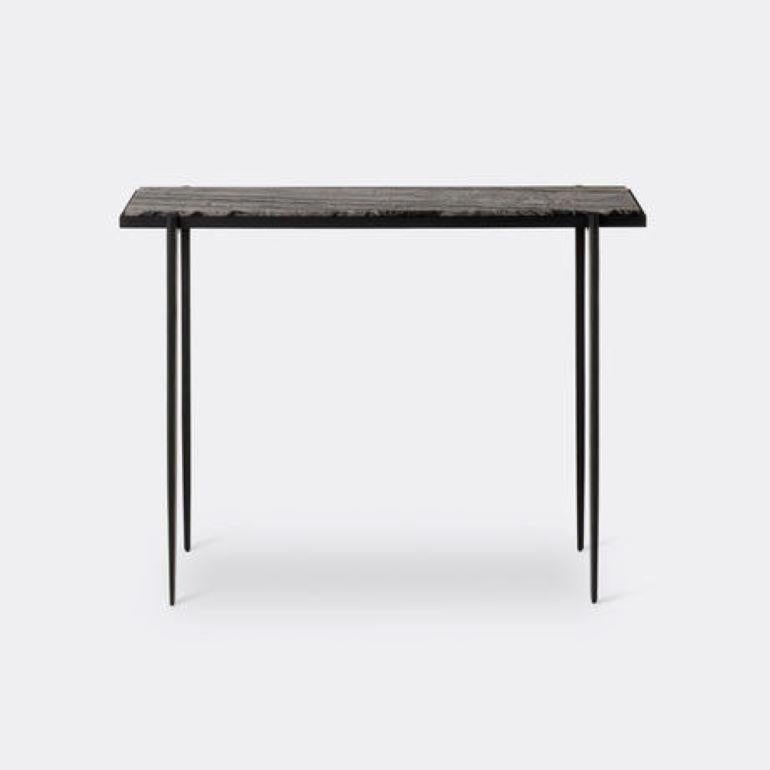 An homage to old-world craftsmanship, the Lark Console combines just two materials—a stone or parchment top with a hand-forged iron base. Its slim profile and customizable length make for a light, compact and versatile table for small entrances and