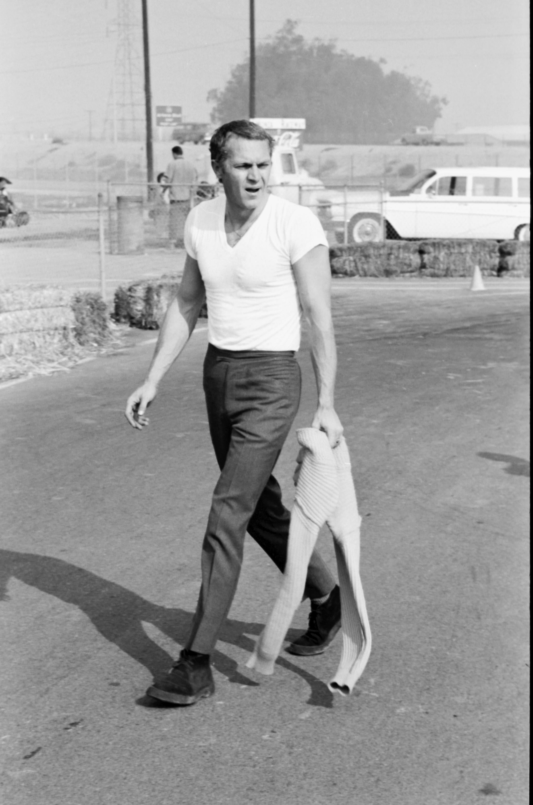 Larry Barbier Portrait Photograph - Steve McQueen Walking on Go-Kart Track Fine Art Print