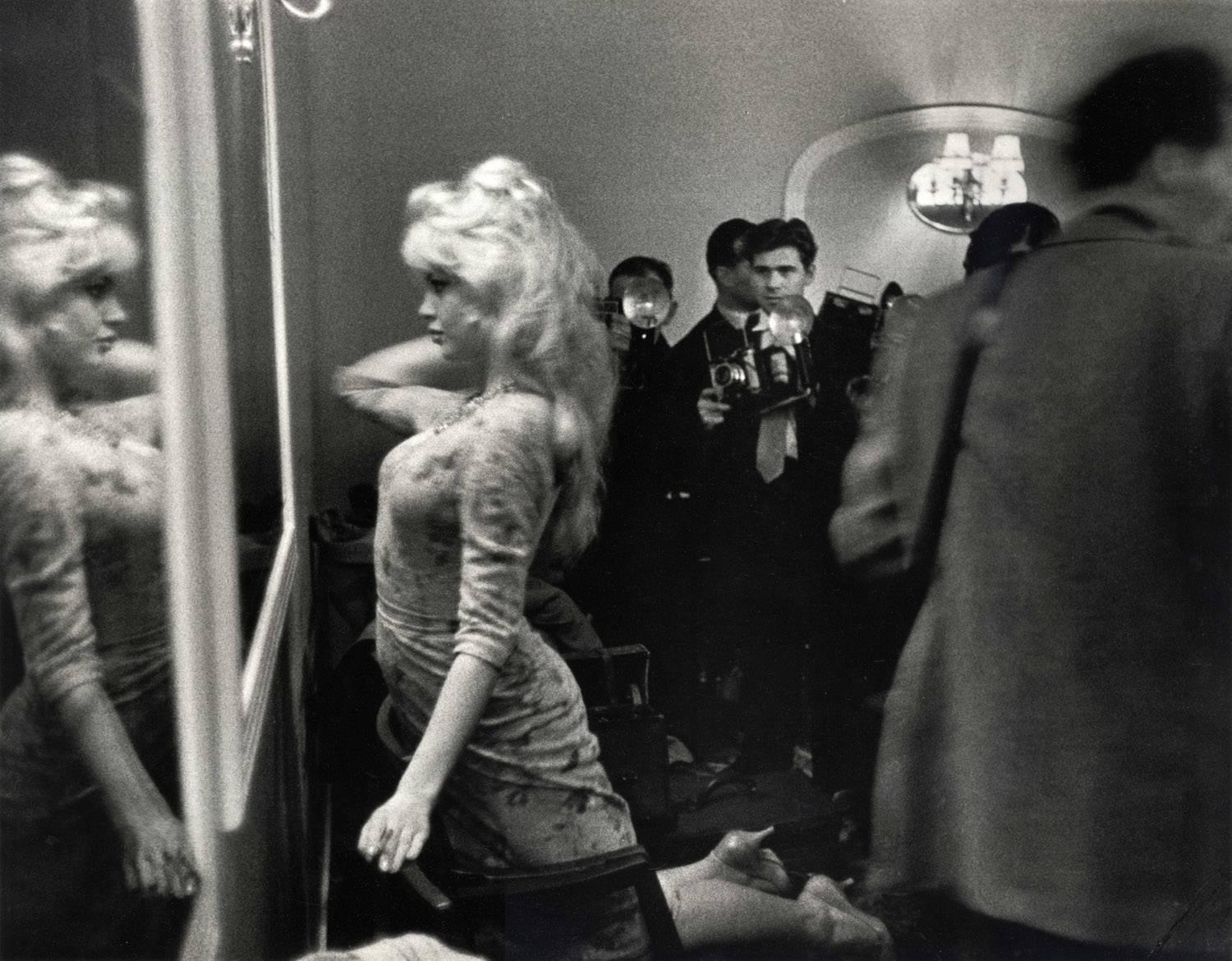 Larry Burrows Black and White Photograph - Brigitte Bardot Prepares to Meet the Press, London