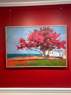 "Crimson Springtime" magenta tree by the sea shades a summer home