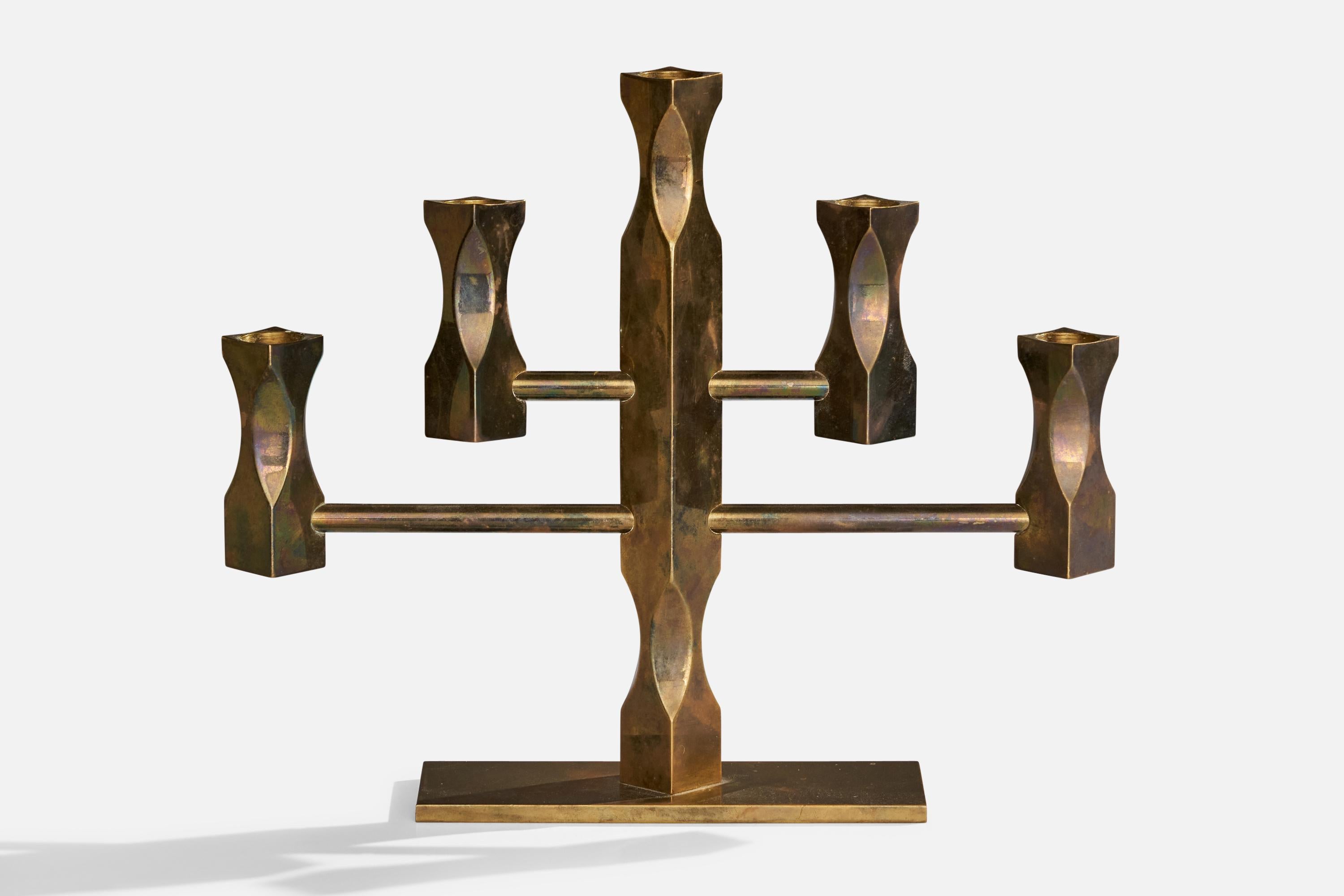 A heavy-alloy brass candelabra designed by Lars Åkesson and produced by Vallonmässing, Sweden, dated 1984.

Holds .8” candles.
