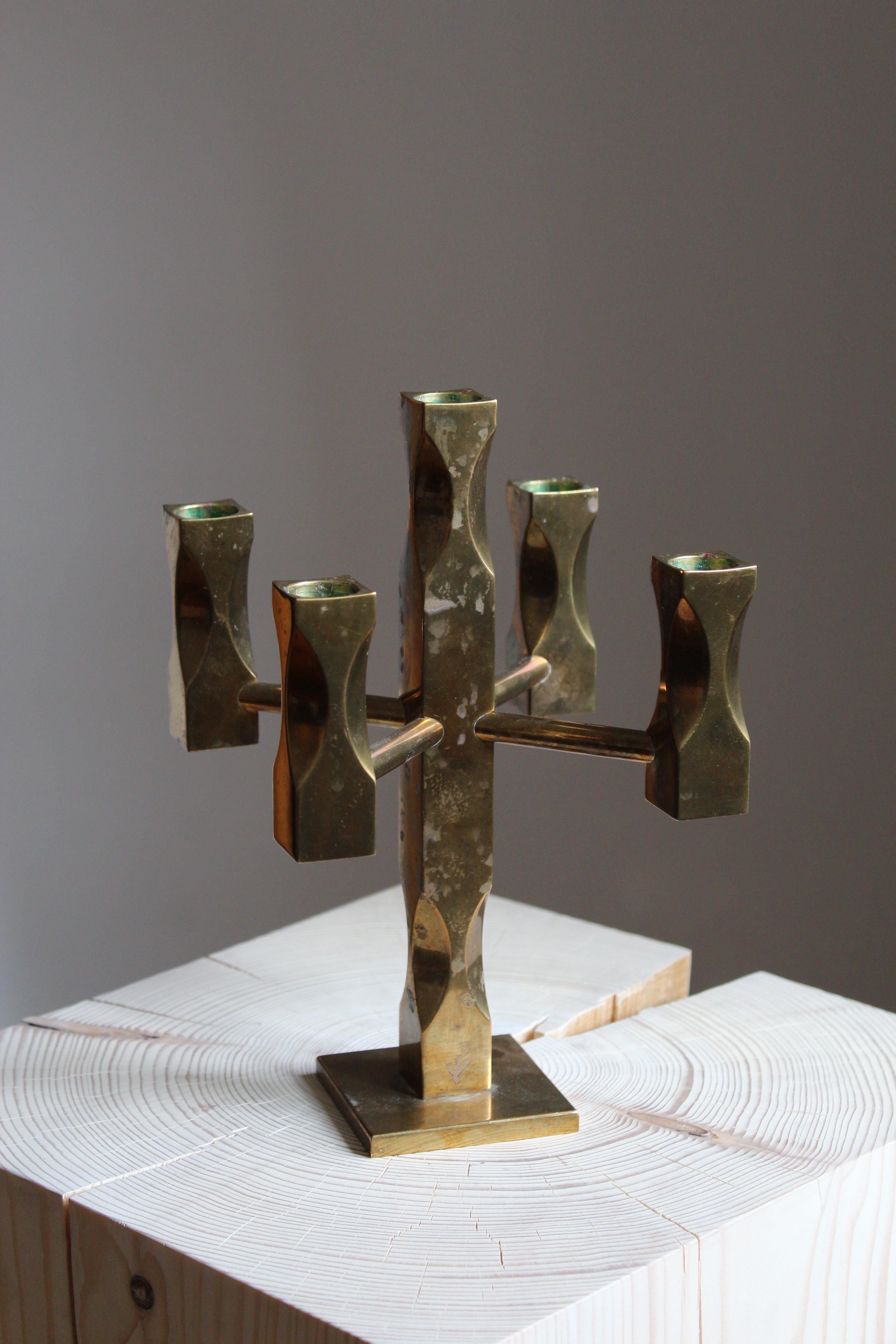 A candelabra. In brass, heavy alloy. Designed by Lars Åkesson. This example signed and dated 1983.

 