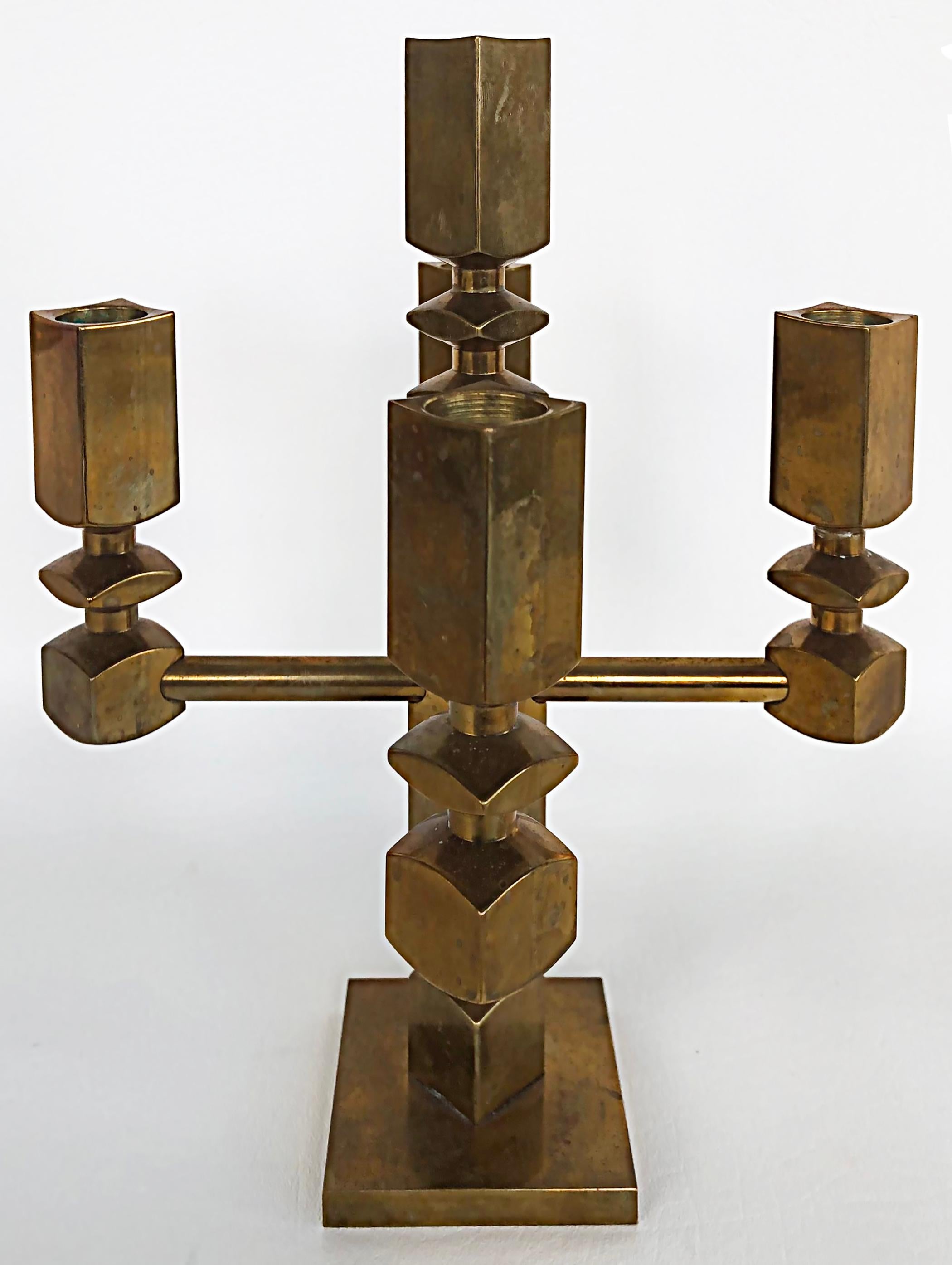 Vallonmässing, Sweden Lars Bergsten brass Candelabra, 1985 

Offered for sale is a Swedish mid-century candelabra designed by Lars Bergsten. The candelabra accepts 5 candles and is marked and dated 1985 underneath the base as shown. It is a rare,