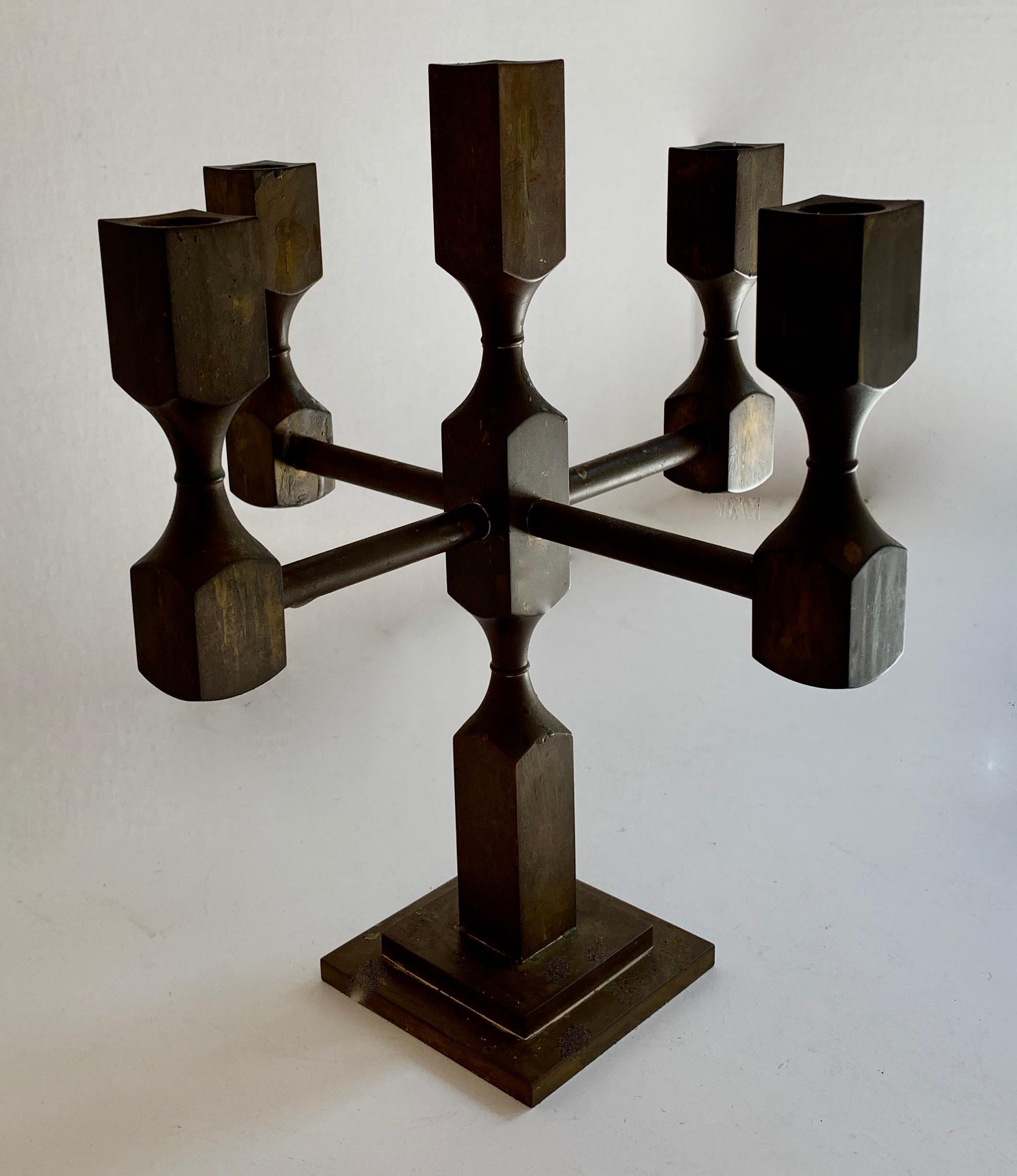 Candelabra by Lars Bergsten, Gusum Metallslöjden, Sweden. A Modernist solid brass candelabra - clean lines, architectural - works well in any environment, from contemporary to more traditional... very heavy at and substantial piece.

The patina is