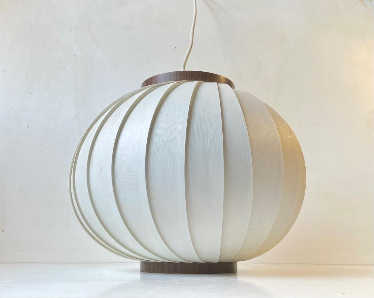 Simplistically composed white crylic pendant lamp called Bojan or Beehive. This is the larger version and it was designed by Lars E. Schiøler and manufactured by Høyrup in Denmark during the 1960s. Similar designs surfaced from Le Klint and Heifetz