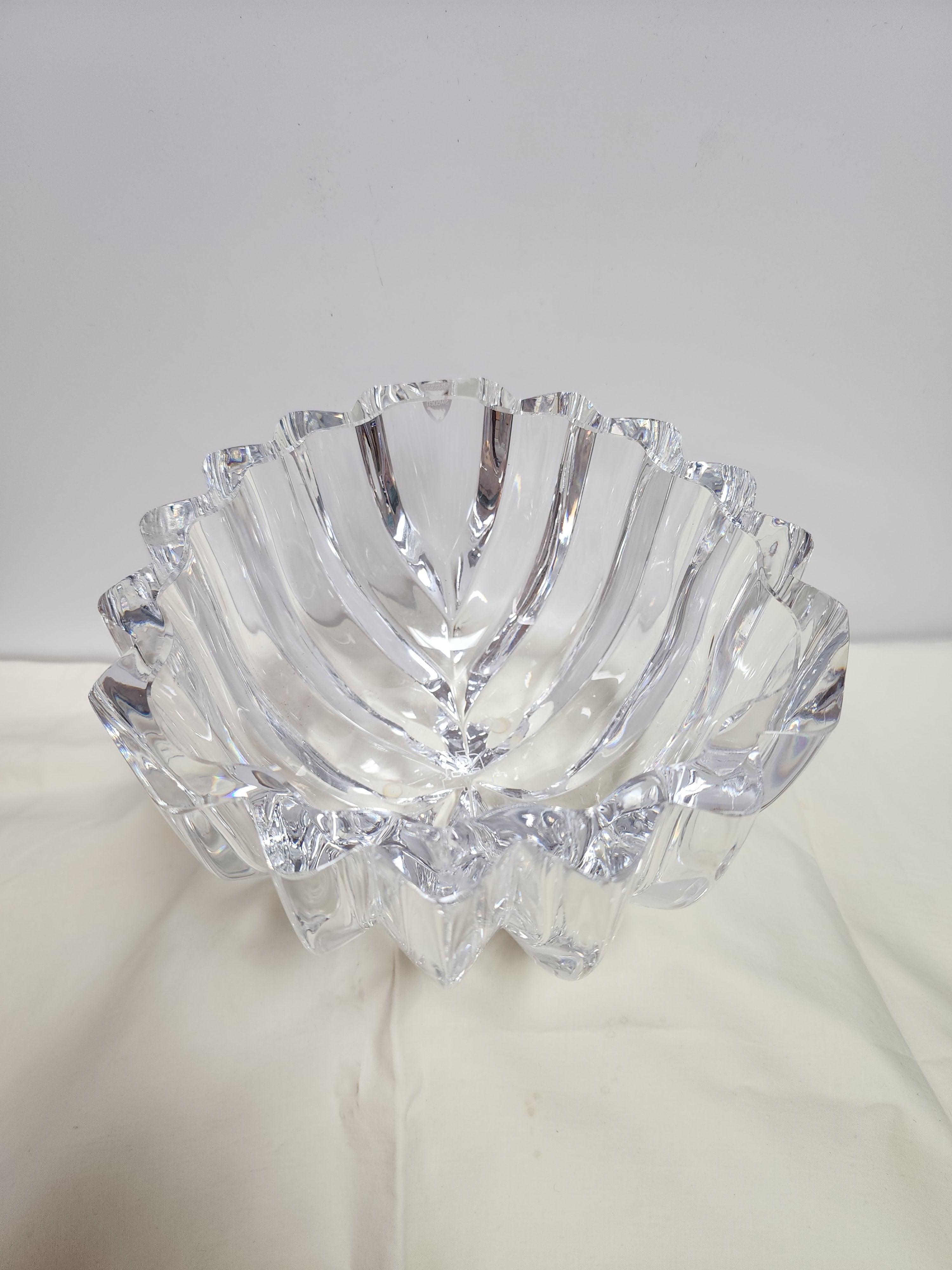 This vintage Swedish cut crystal bowl was designed by Lars Hellsten. It is very heavy and high quality. The original sticker is intact and the signature is clear. The stamped logo is also clearly visible. 