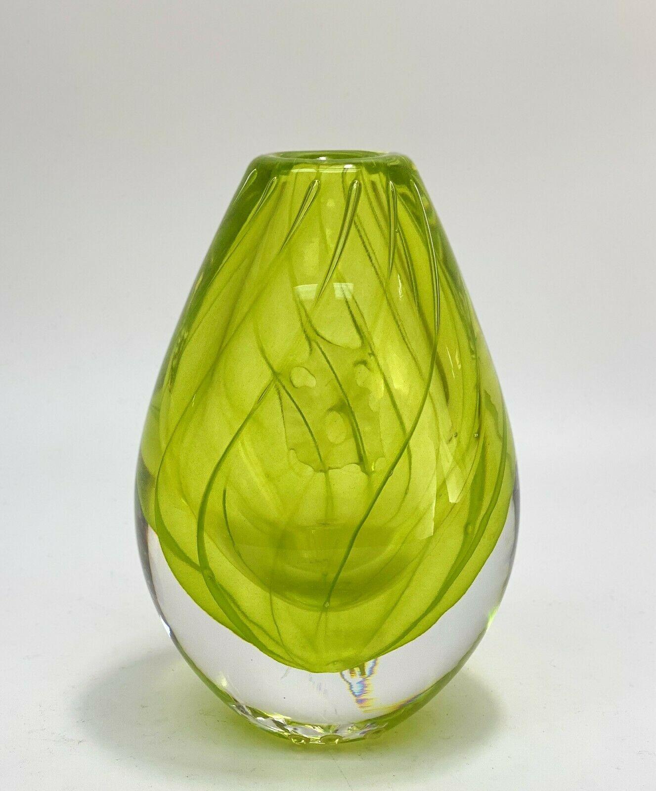 Lars Hellsten Orrefors Sweden Expo Art glass vase signed

Light green glass vase with a controlled air bubble in the shape of a sun. Orrefors Sweden label to lower edge. Underside signed Orrefors Expo 5264-22, 100 Lars Hellsten,