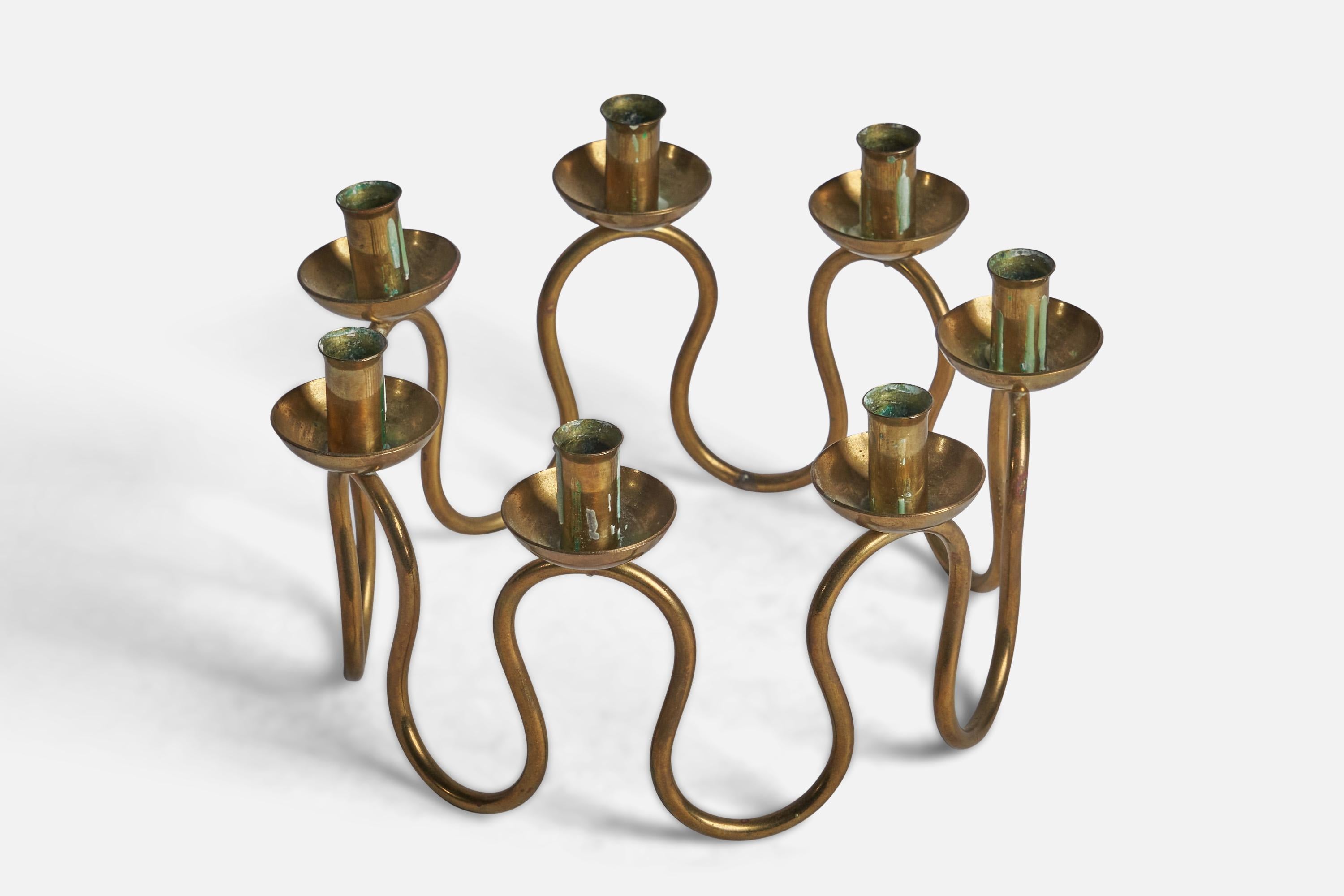 A small brass candelabra designed and produced by Lars Holmström, Sweden, 1930s.

Holds 0.5” diameter candles