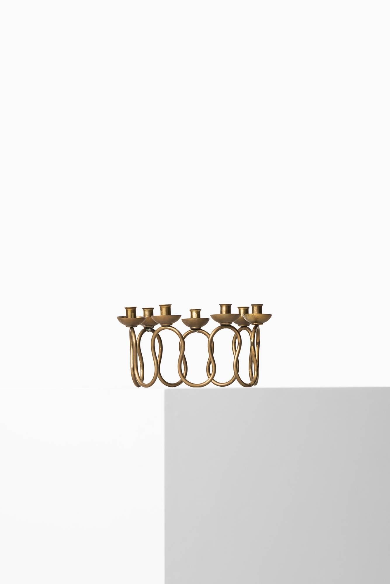 Brass candlestick designed by Lars Holmström. Produced by Lars Holmström in Arvika, Sweden.