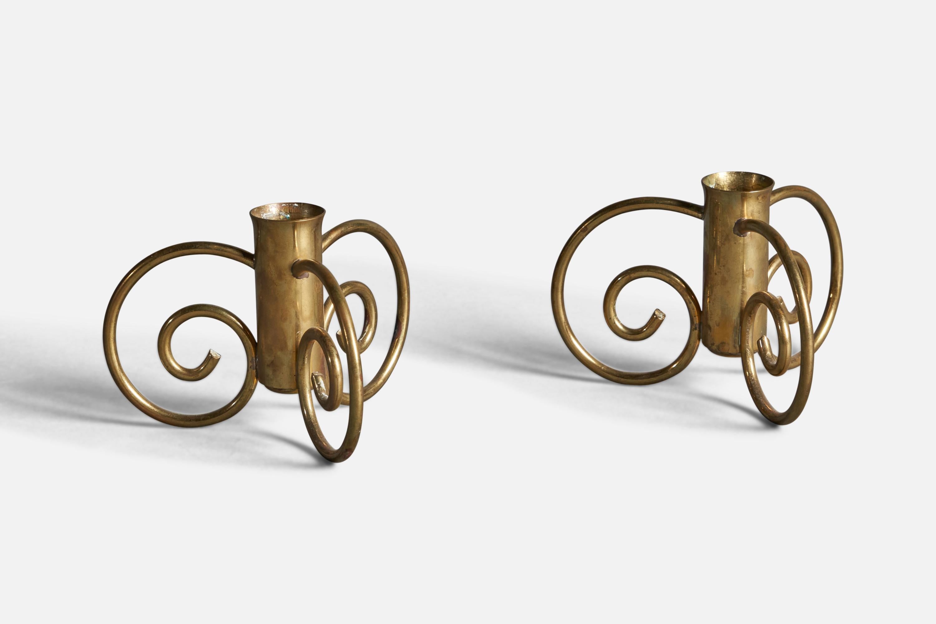 A pair of brass candlesticks designed and produced by Lars Holmström, Arvika, Sweden, c. 1930s.

Candle Diameter (inches): 0.9” 