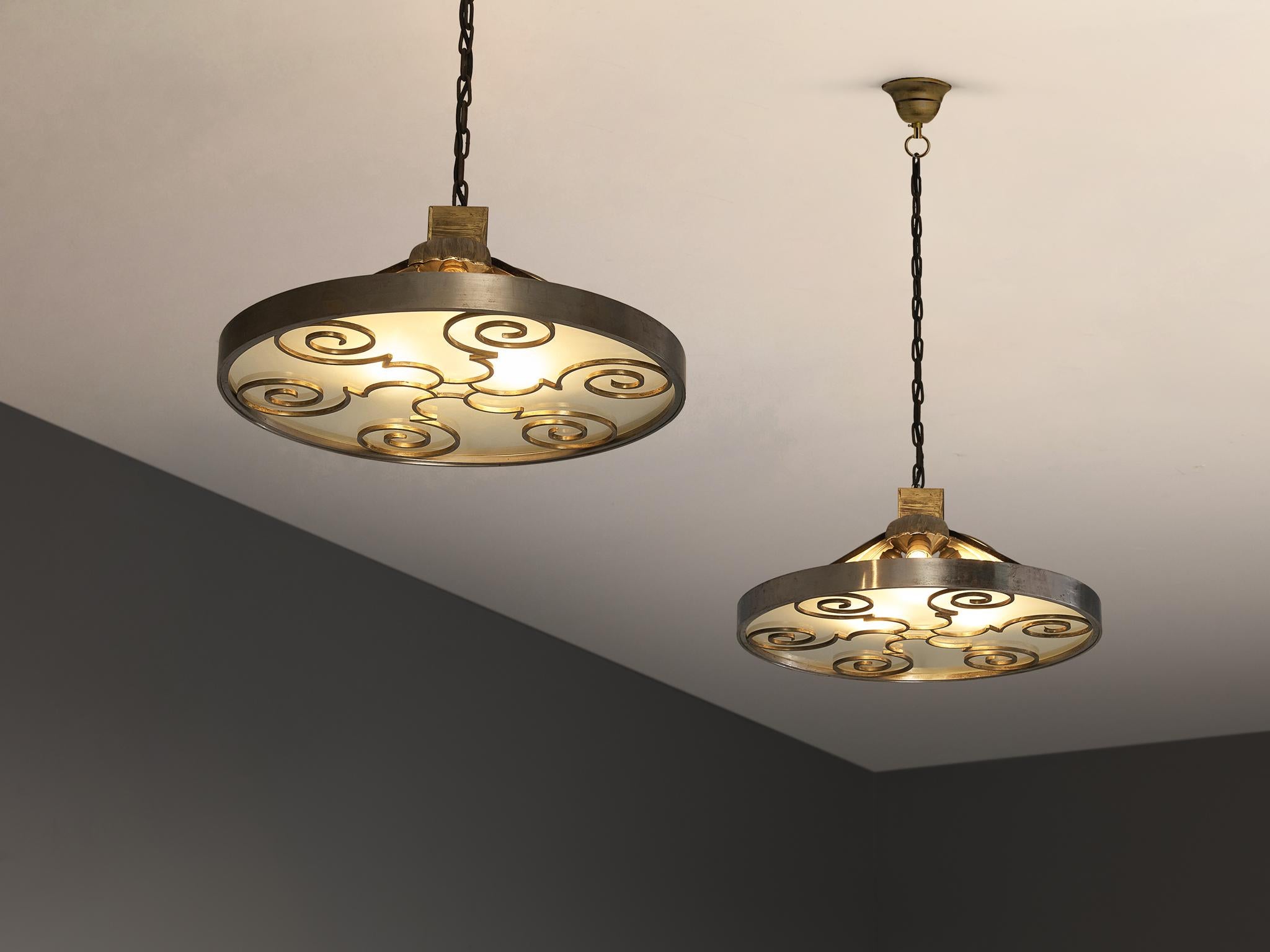 Lars Holmström for Arvika Konsthantverk, ceiling lights, brass, brushed steel, matt glass, Sweden, 1930s

These stunning plafonieres, a true testament to Holmström's craftsmanship, is a blend of brass, steel, and glass, epitomizing the elegance and
