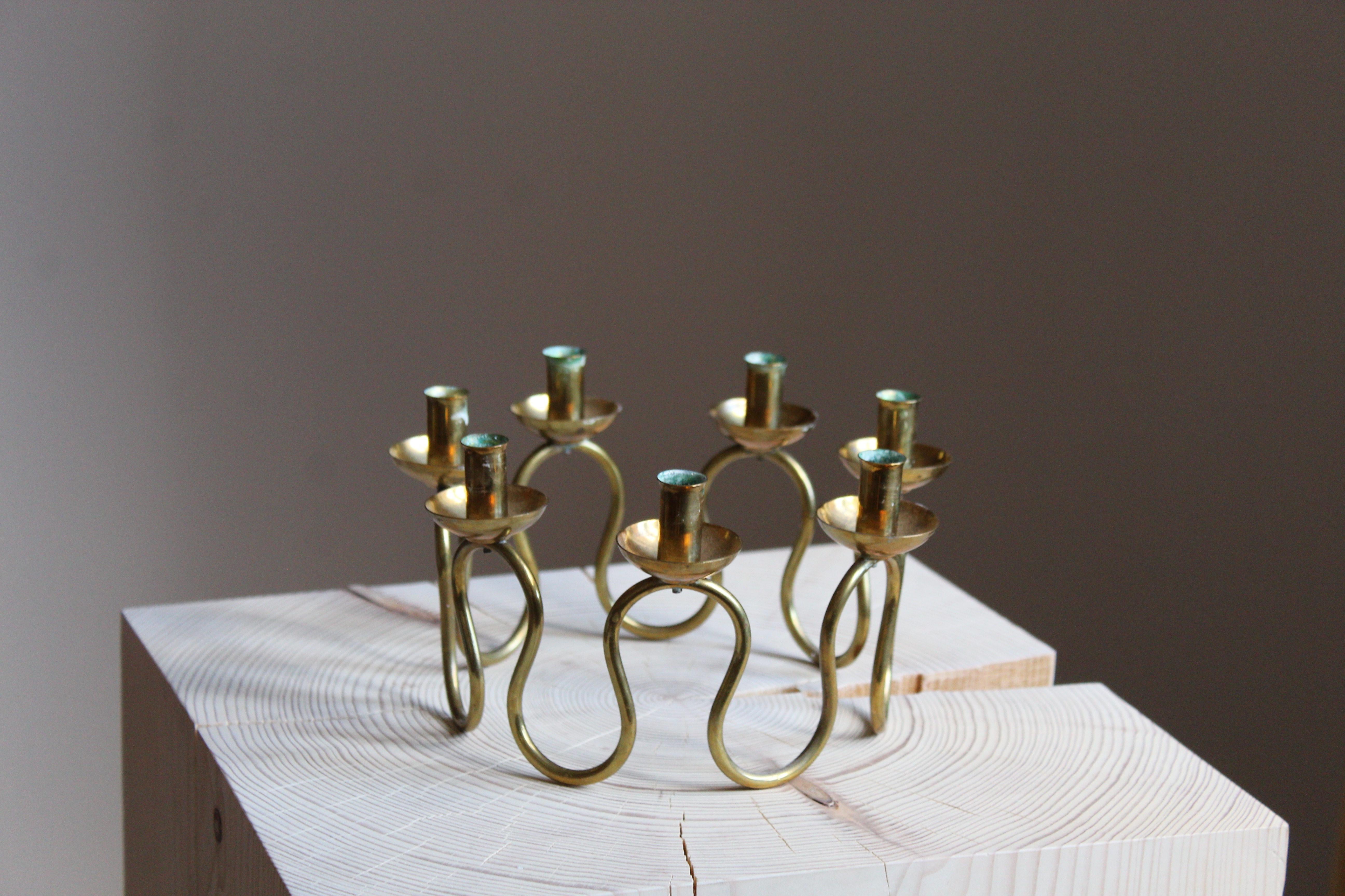 A pair of organic candelabra, designed by Lars Holmström for Svenskt Tenn, Sweden, 1950s. In brass. For small candles.

Other designers of the period include Piet Hein, Paavo Tynell, Josef Frank, and Jean Royere.

 